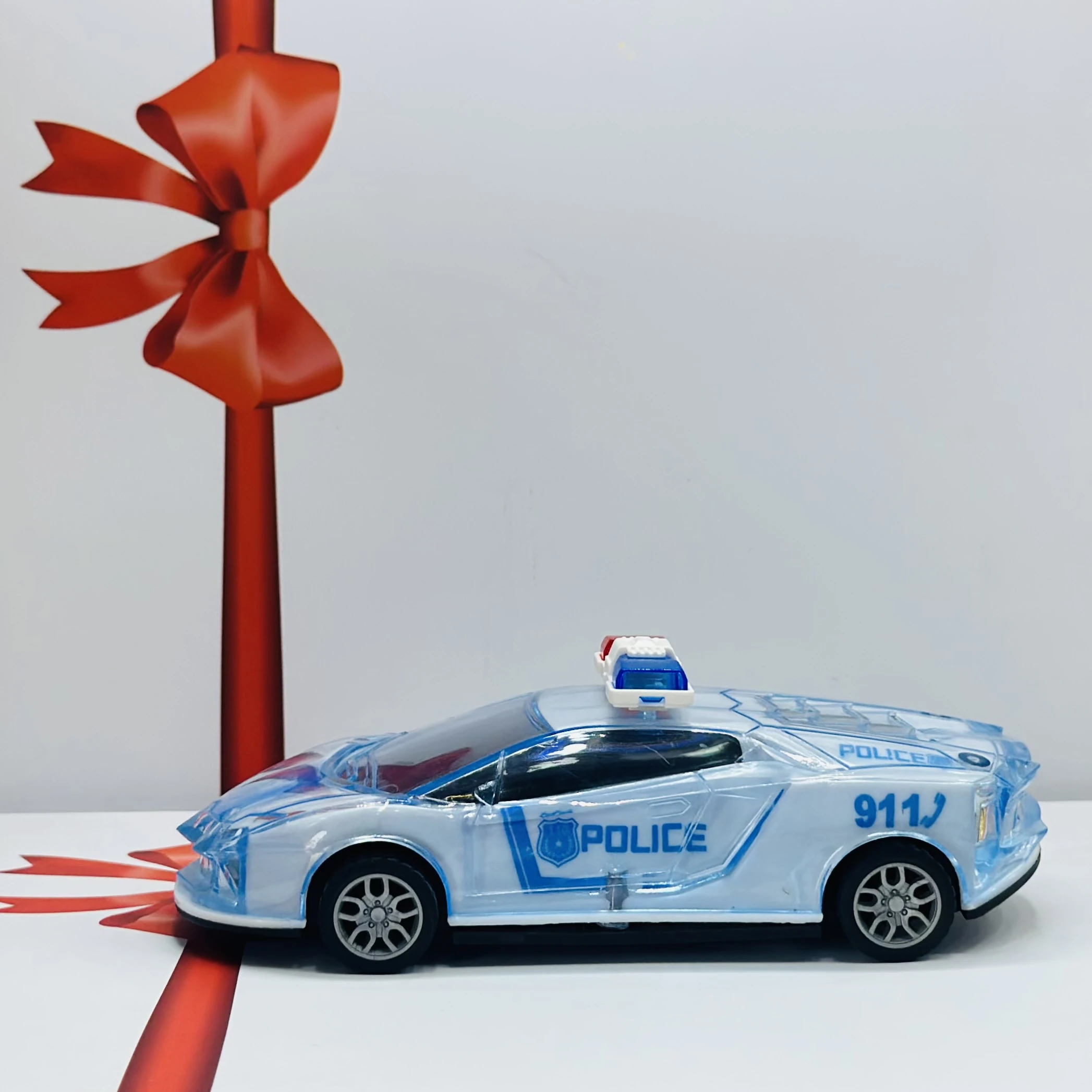Toy police car with a transparent body and light-up features.
