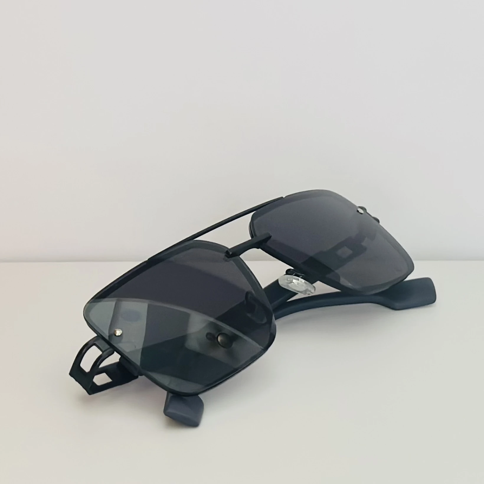 pair of black metal rectangular sunglasses.