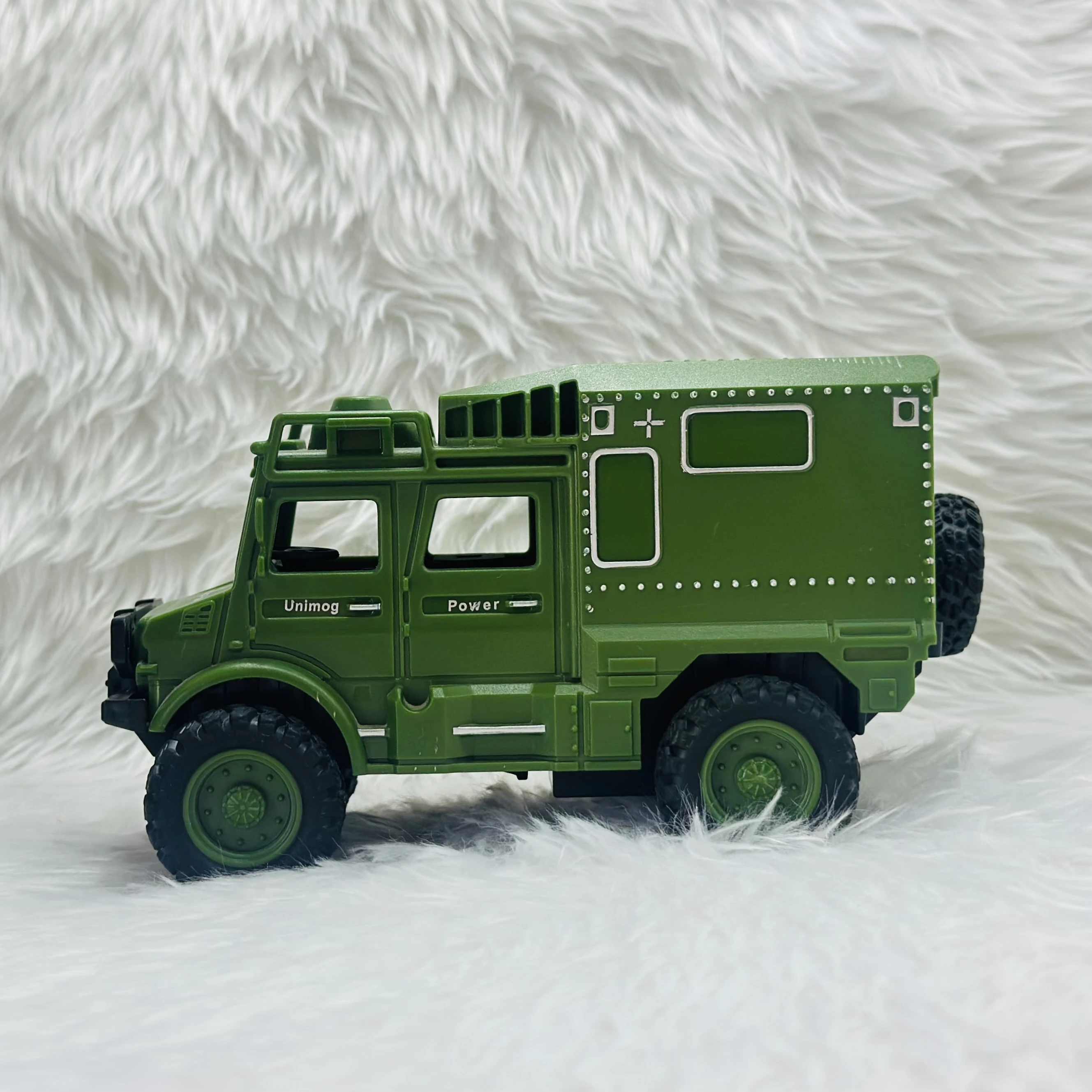 Toy Club Unimog army truck toy.