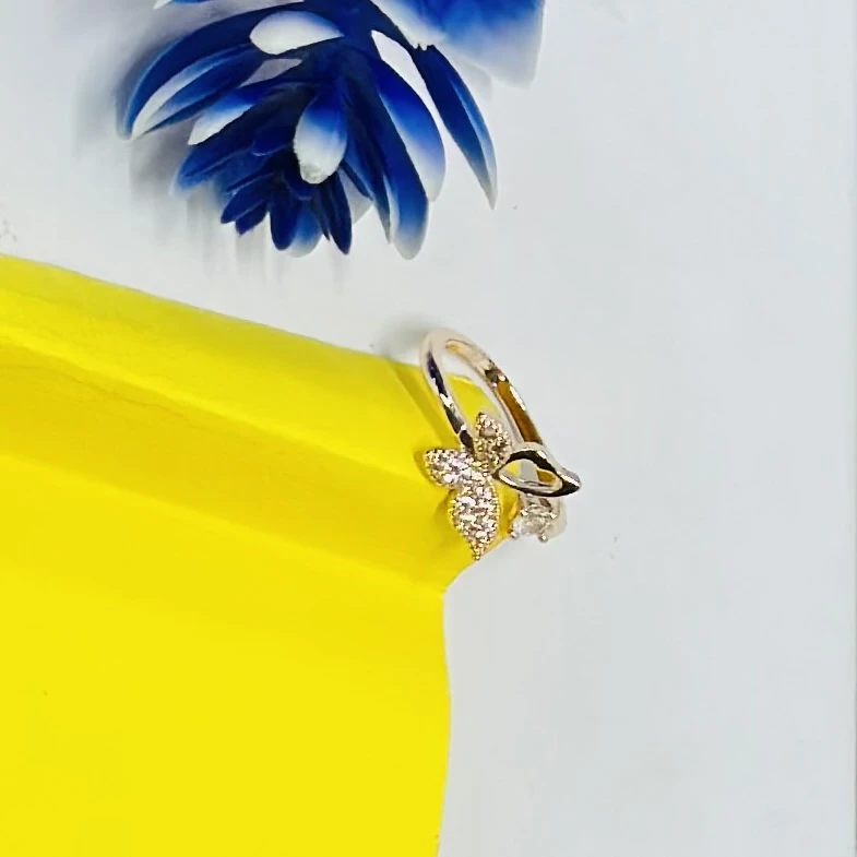 An adjustable rose gold-plated butterfly ring
