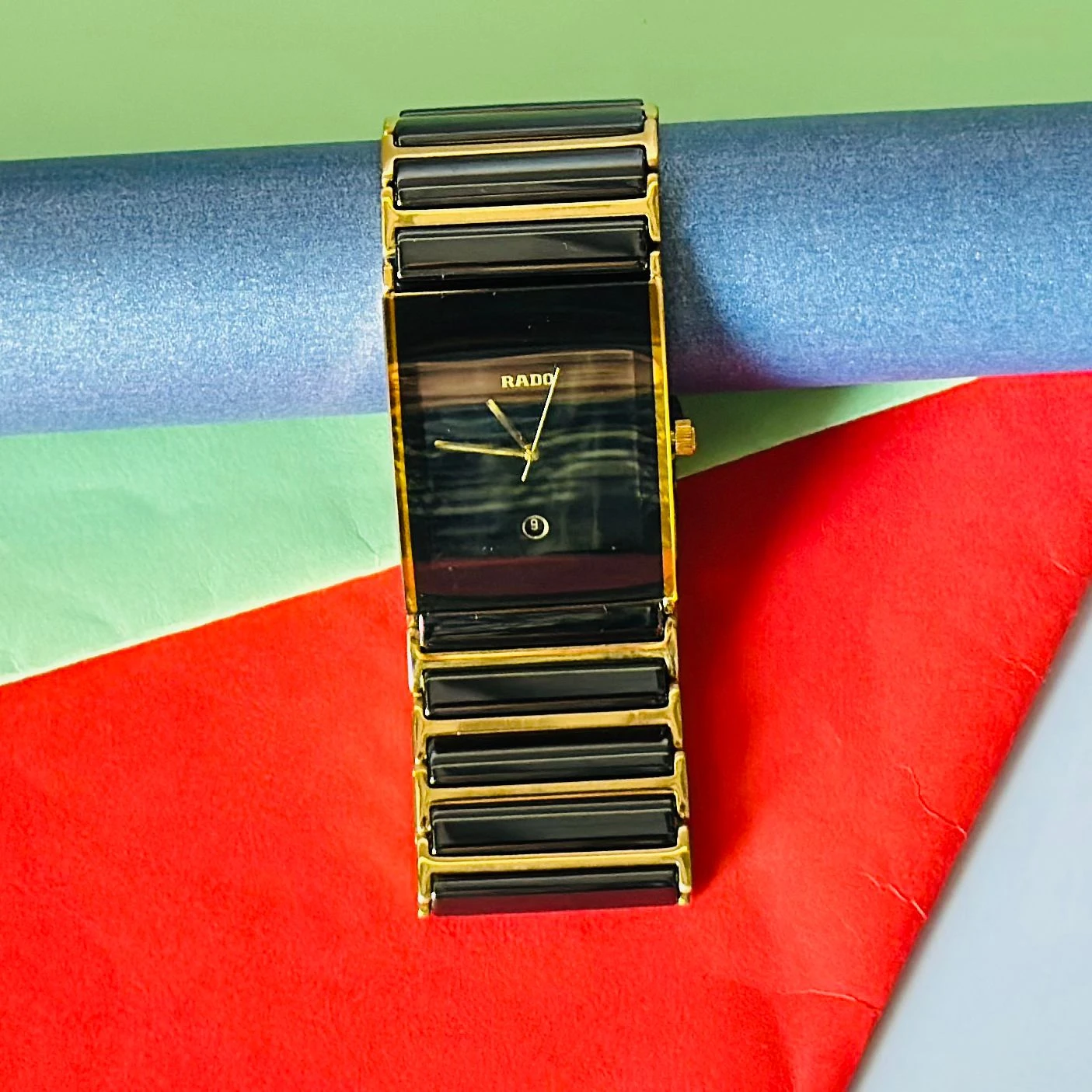 Rado Integral black ceramic and yellow gold-tone watch.