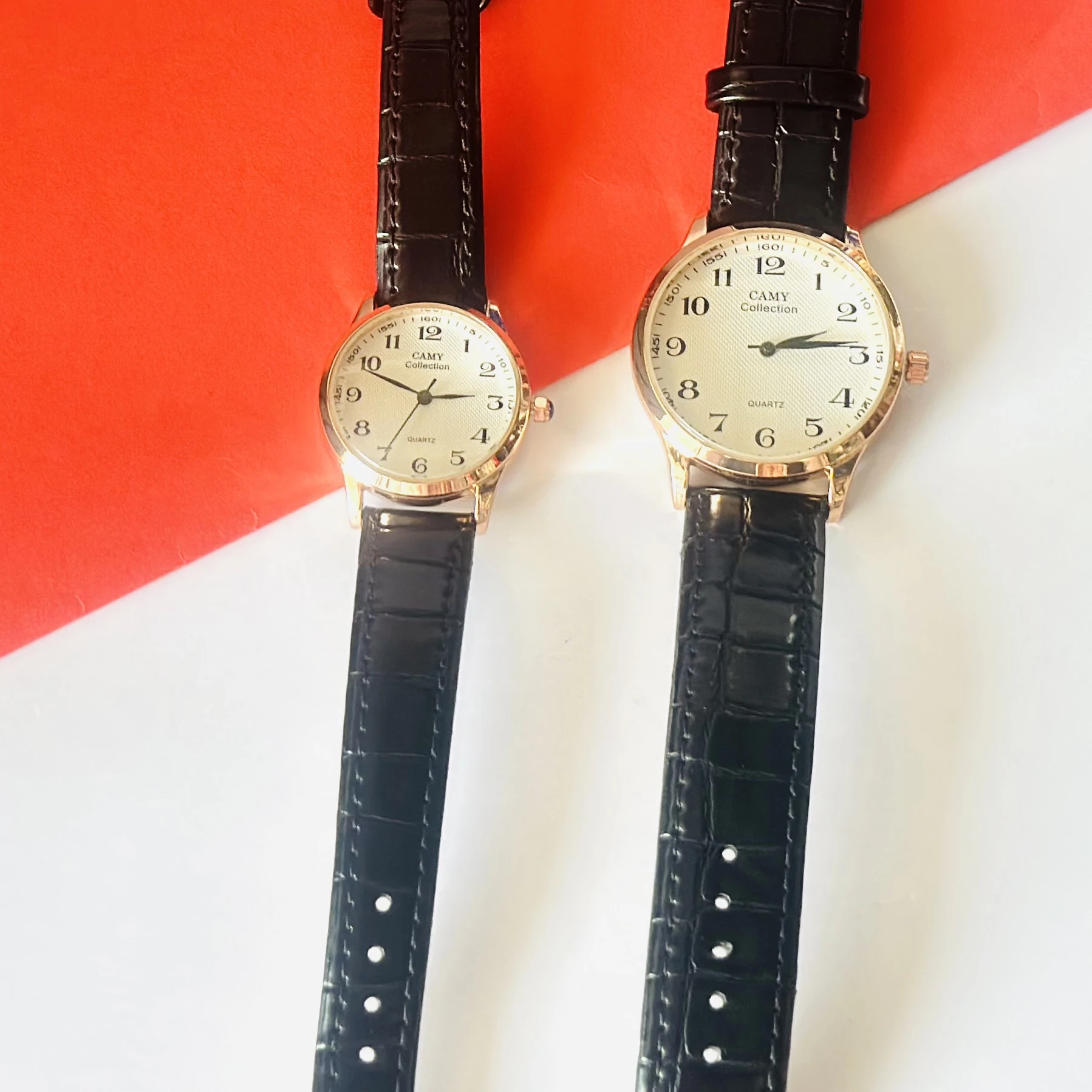 men's Camy Collection analog quartz watches with black leather straps and cream dials.