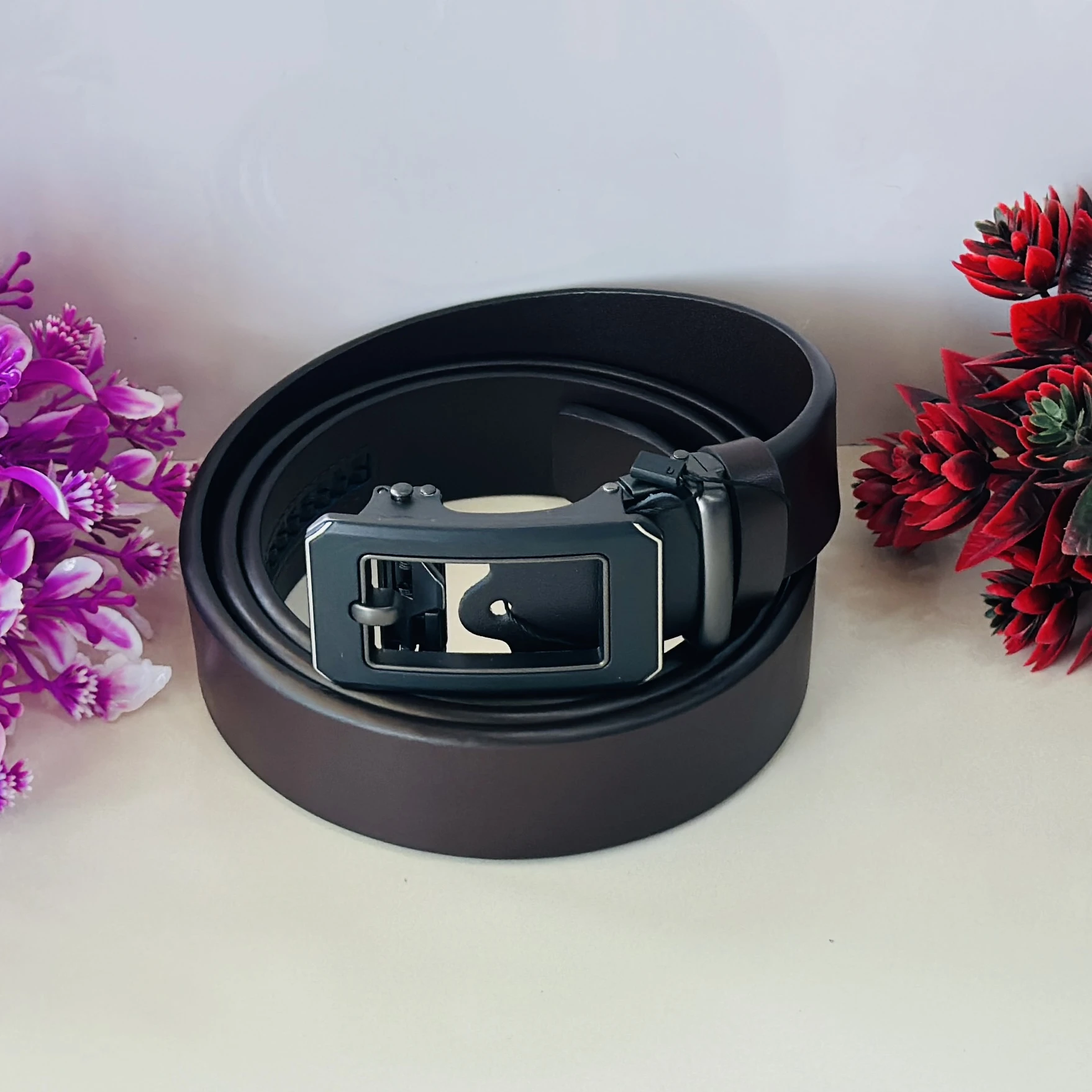Brown leather auto-lock or ratchet buckle belt for men.