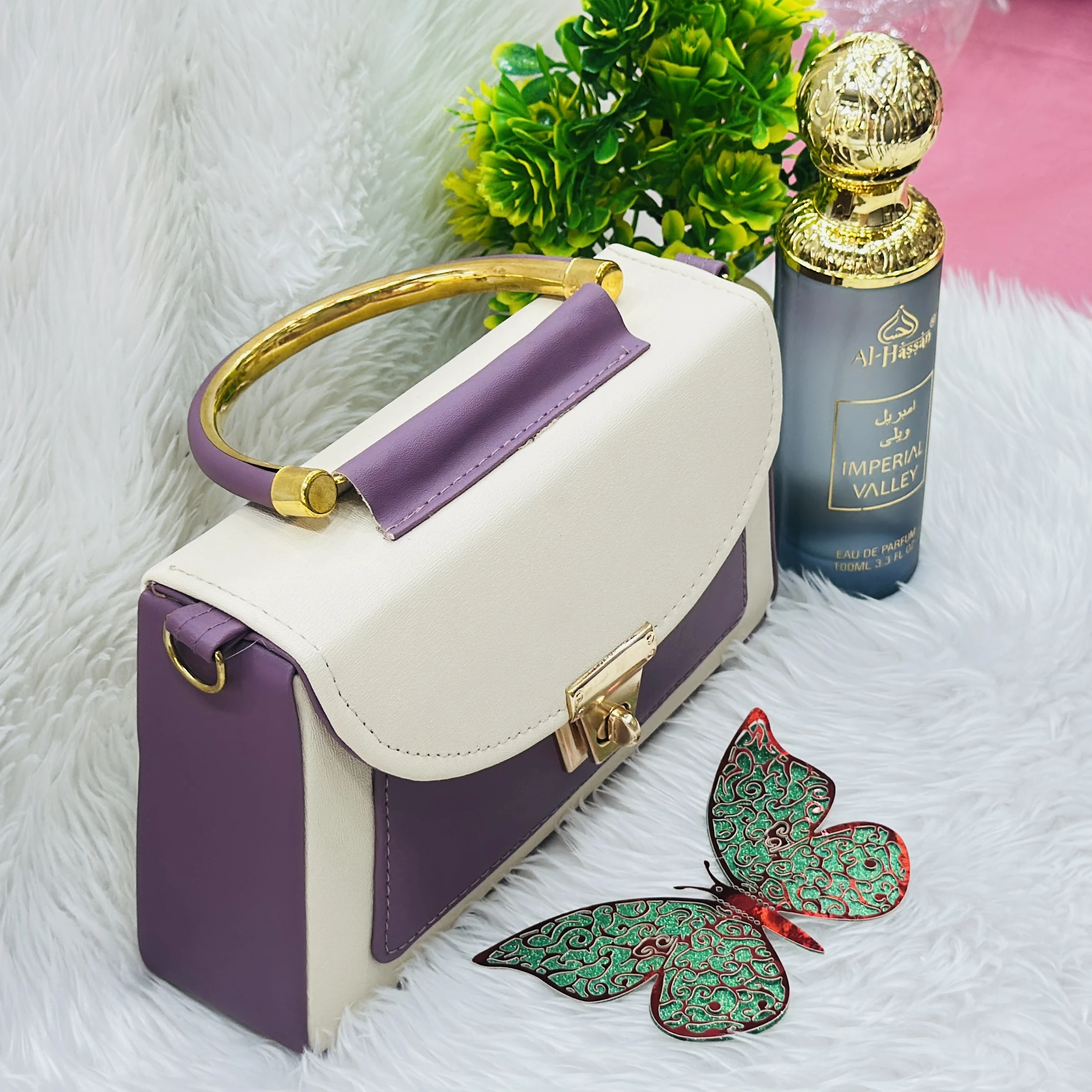 purple and cream top-handle handbag