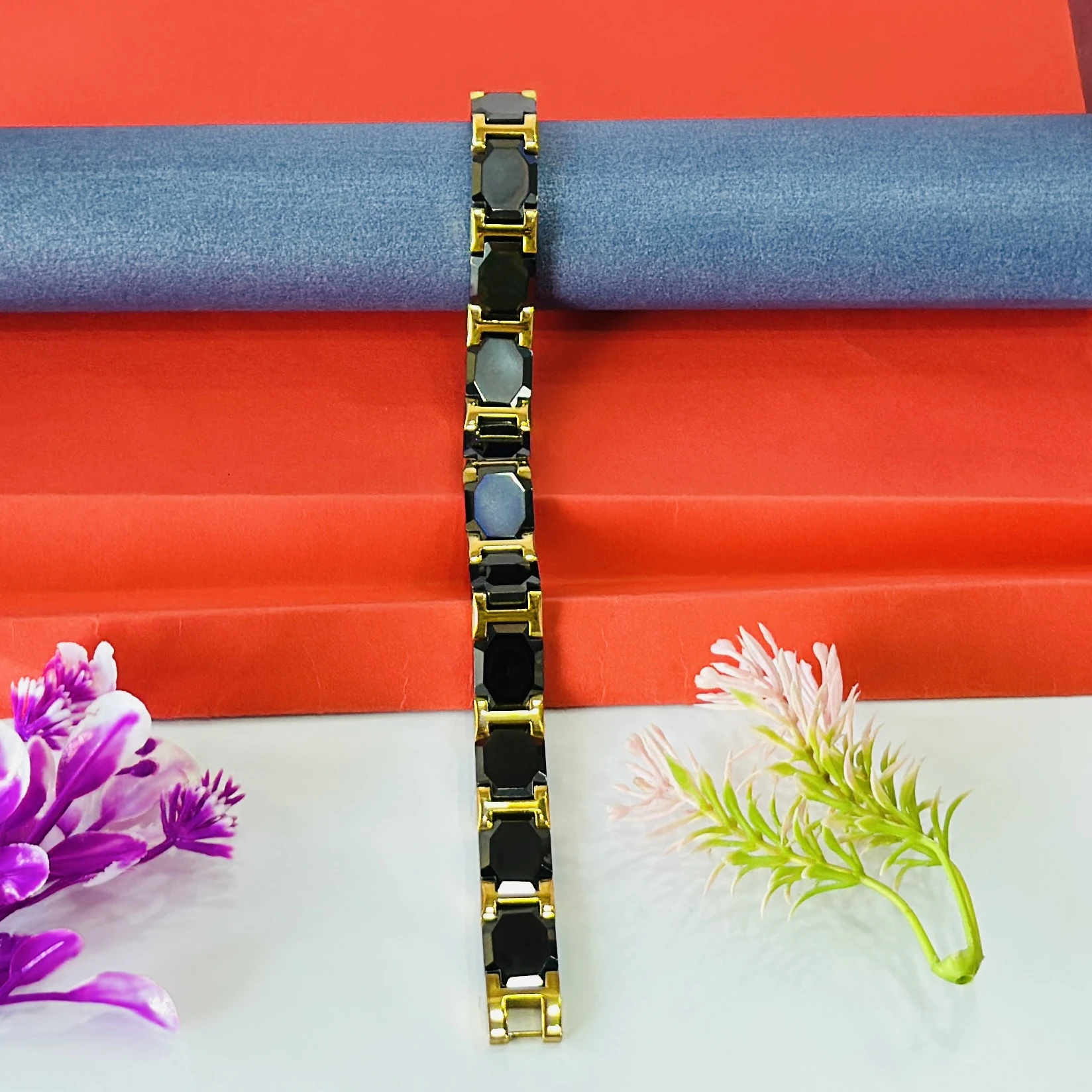 Black ceramic and gold-tone magnetic link bracelet.