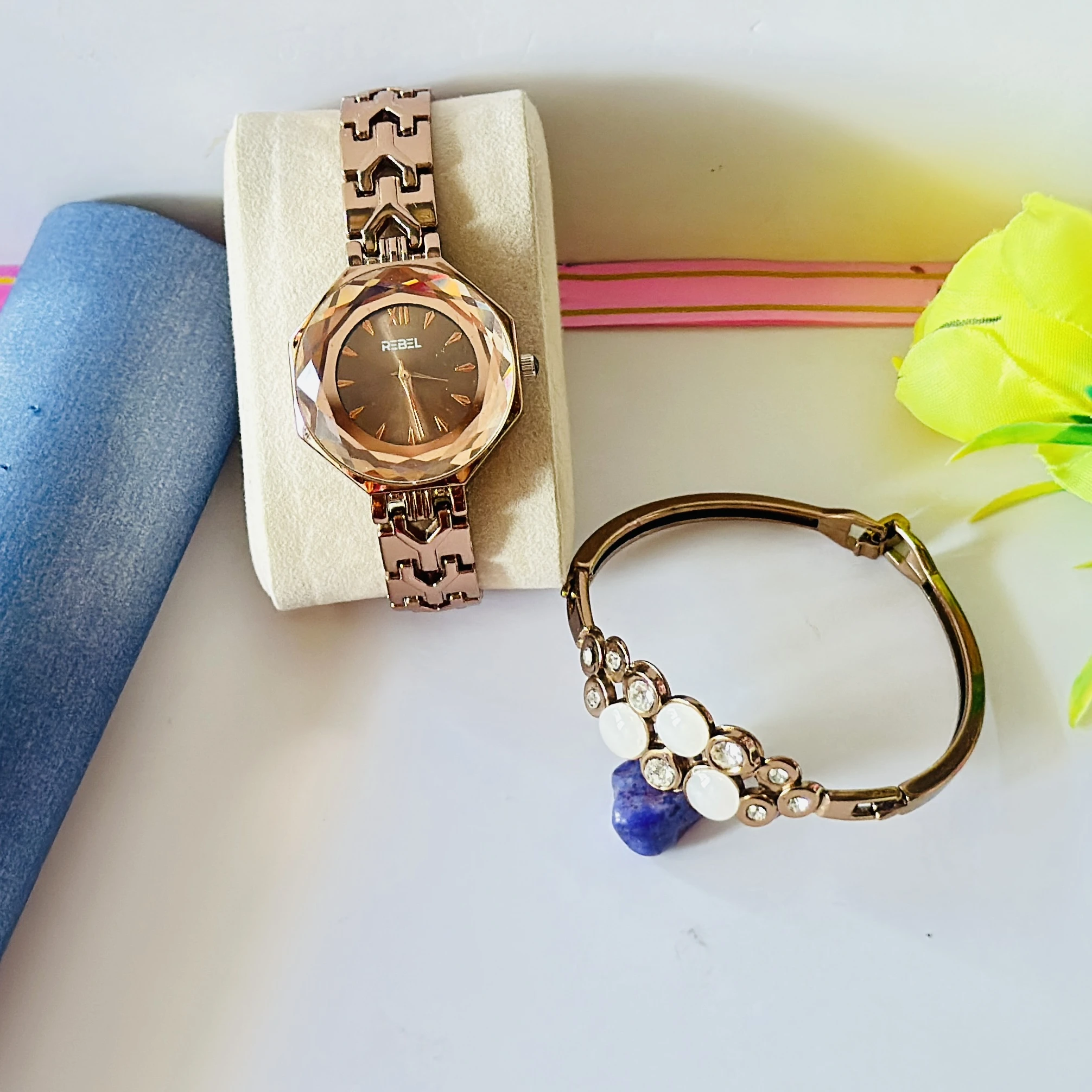 women's analog watch and a bracelet in rose gold tone