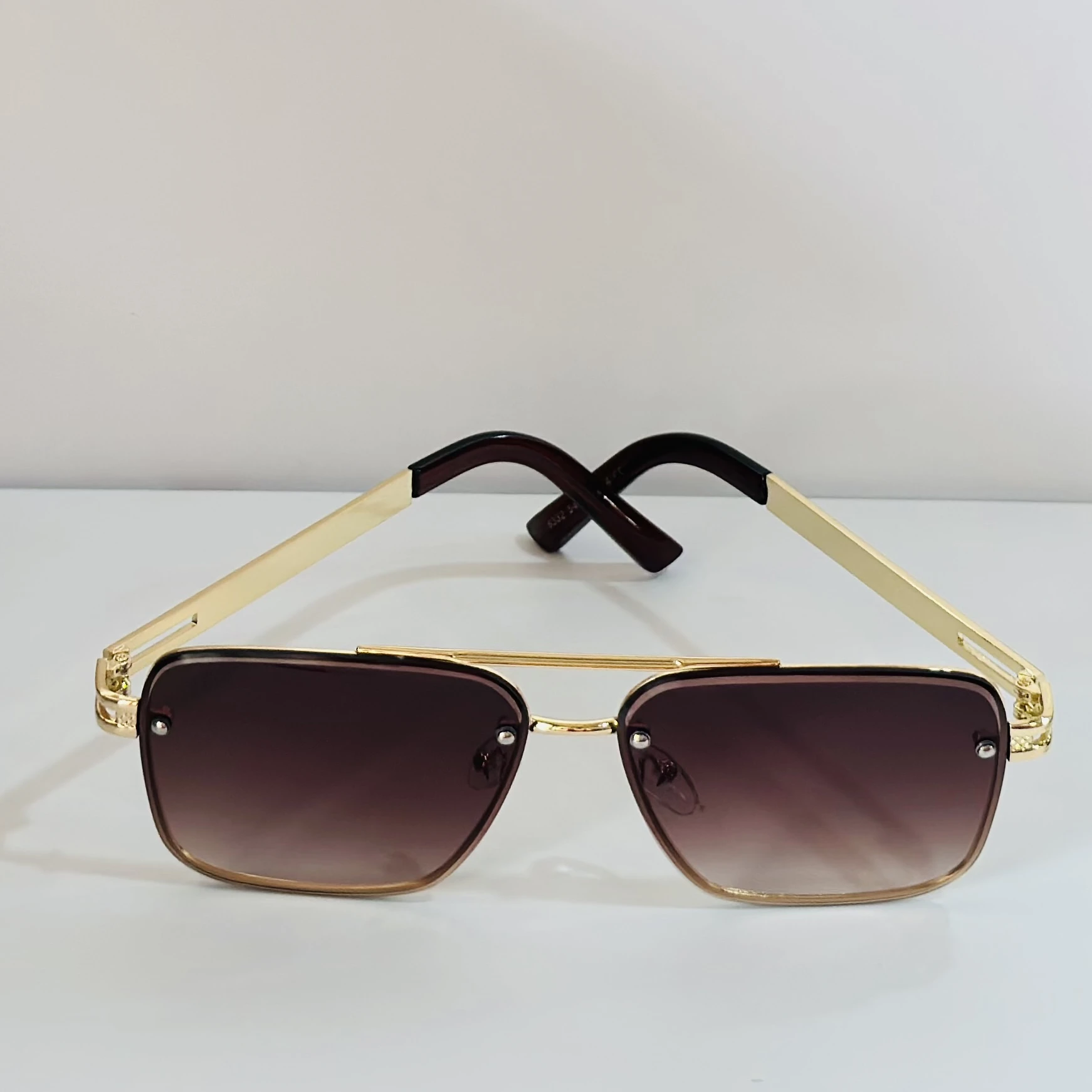 pair of Maybach aviator sunglasses with a gold-tone frame and brown gradient lenses