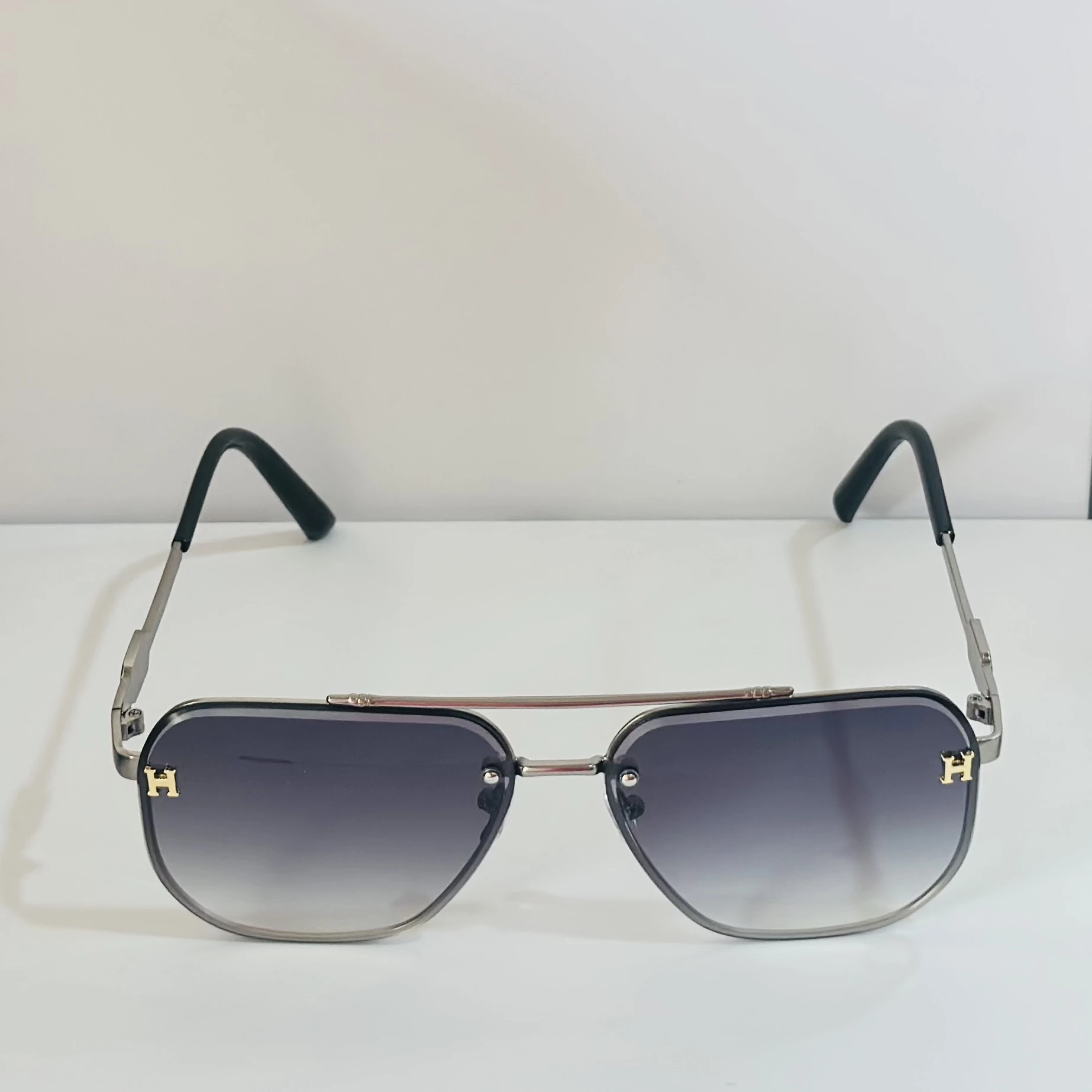 pair of Maybach aviator sunglasses with black and gold details.
