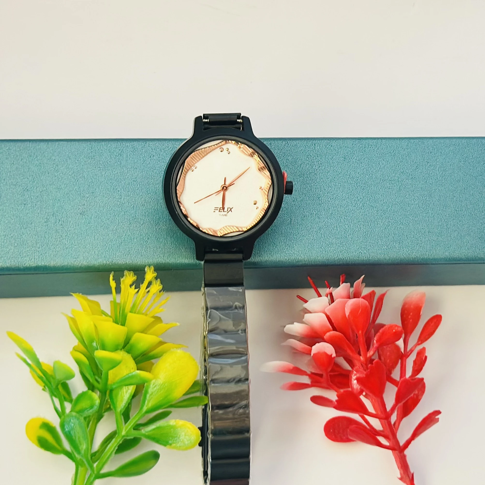 Felix Time analog watch for girls with a fancy metal strap.