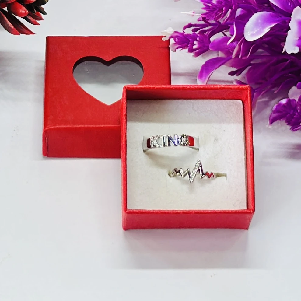 set of silver-plated, stone-studded, adjustable couple rings.