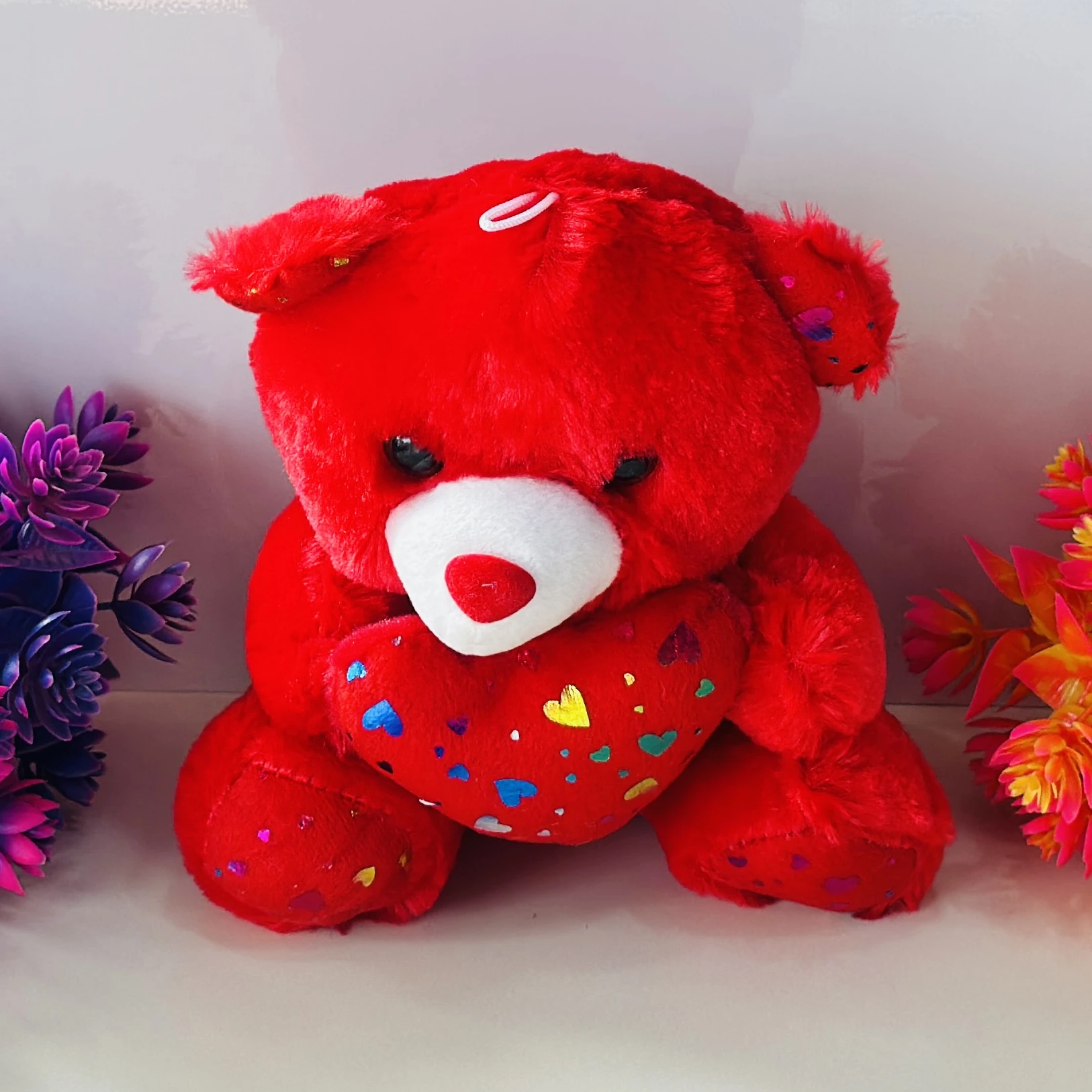 Red Lovely Teddy Sitting With Heart stuffed plush toy.