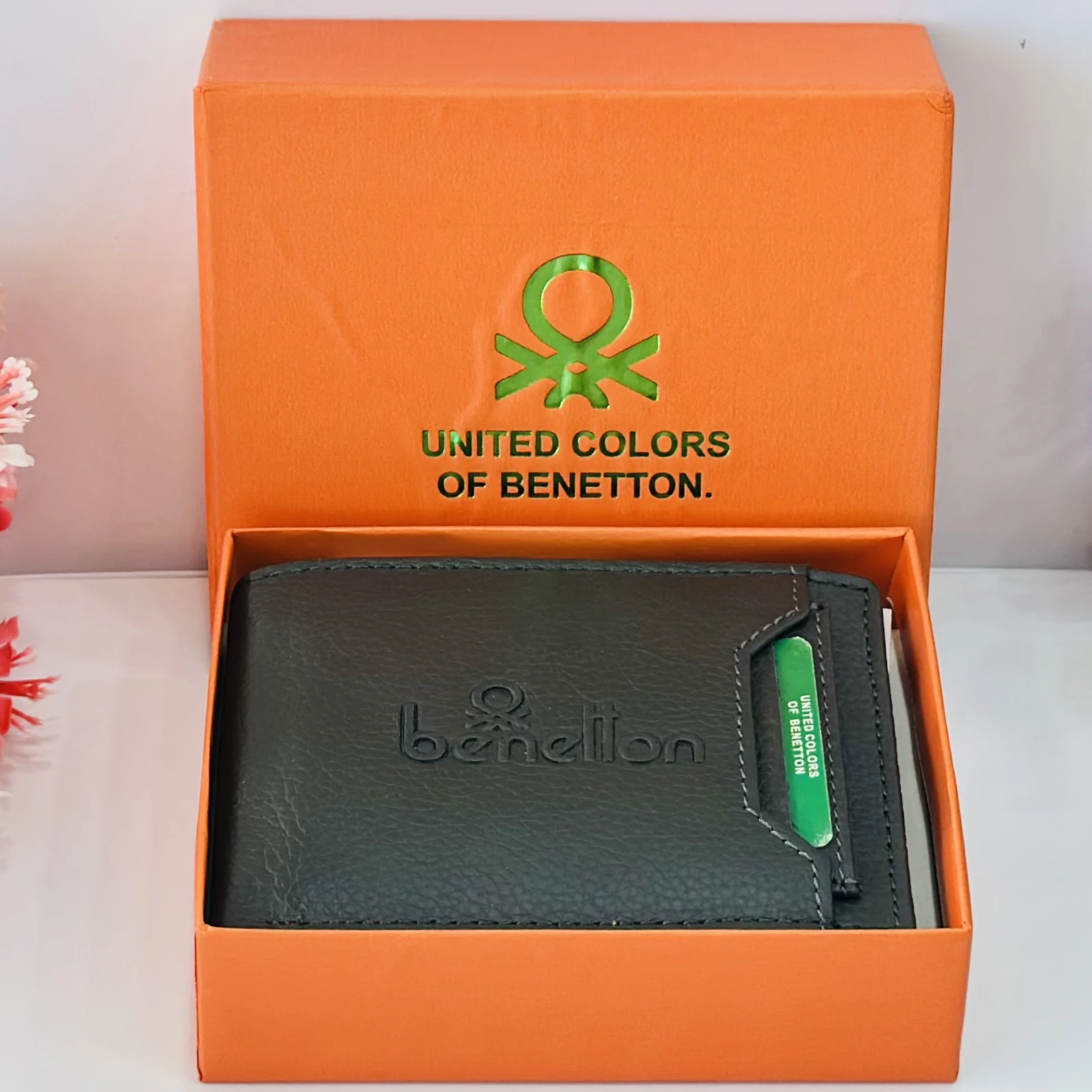 Black leather bi-fold wallet from United Colors of Benetton.