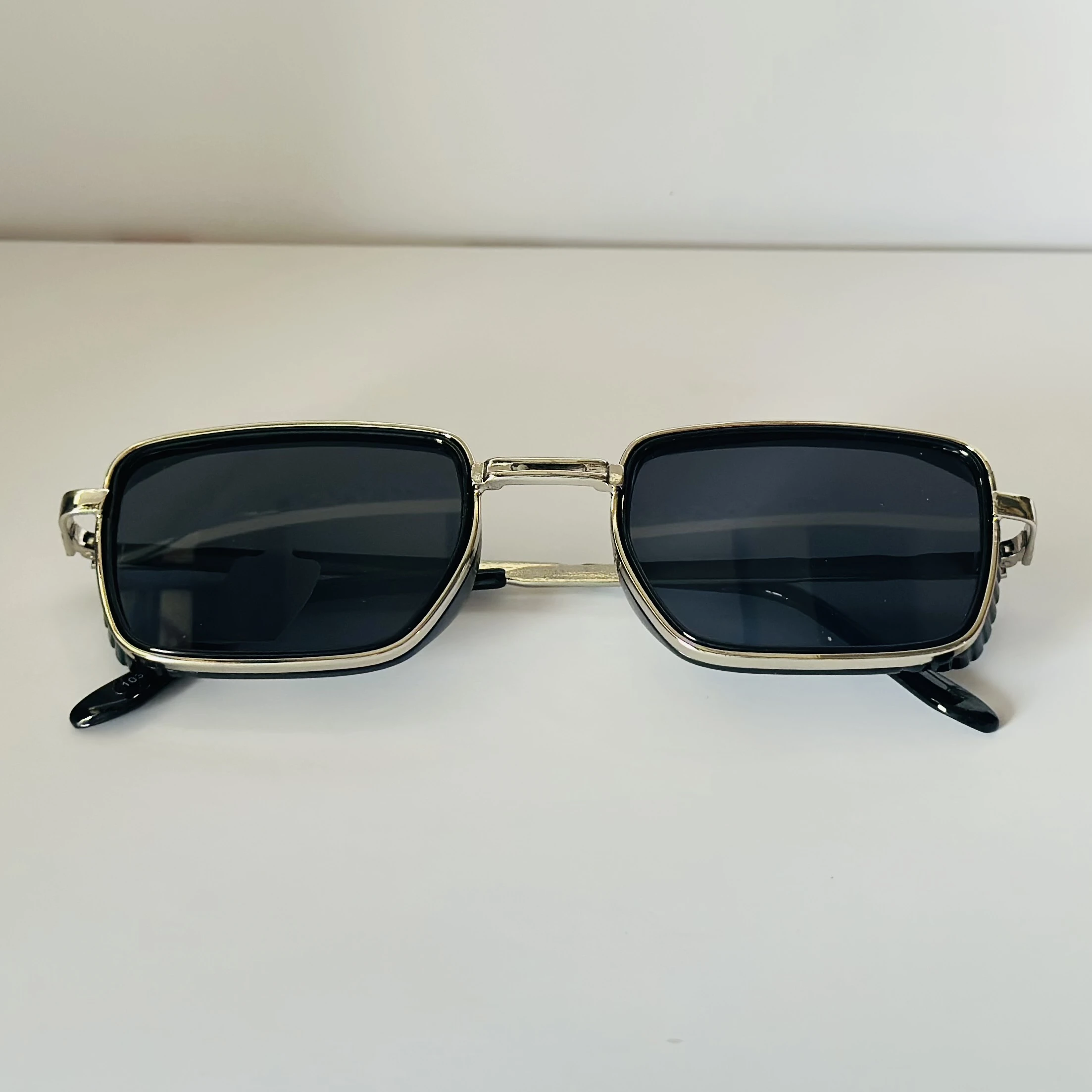 pair of Aedoll Goggle sunglasses with a gold metal frame and pink gradient lenses.