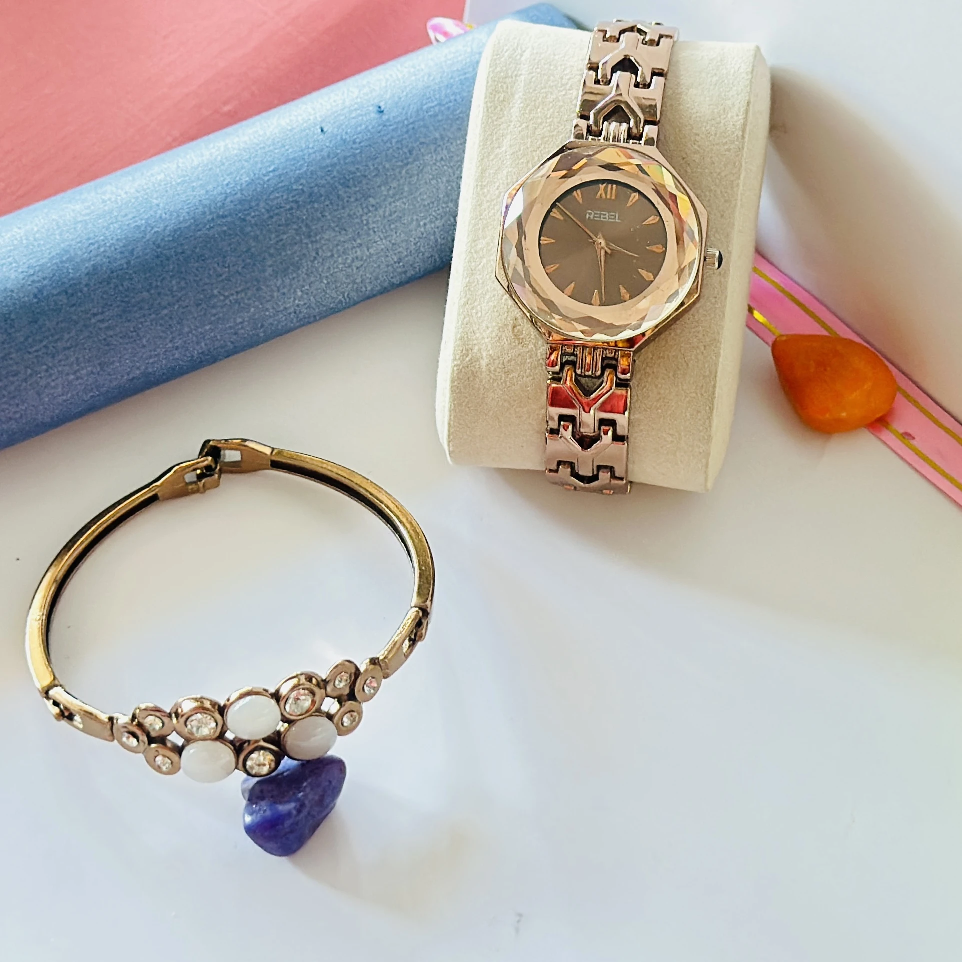 women's analog watch and a bracelet in rose gold tone