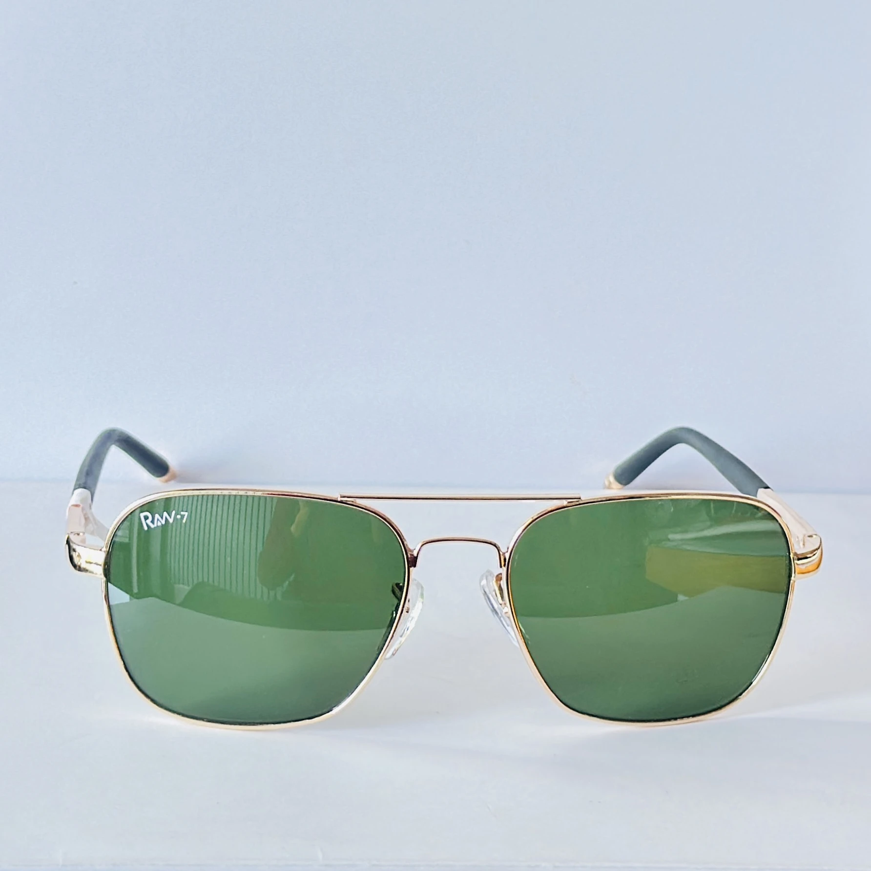 appear to be retro square or aviator-style sunglasses