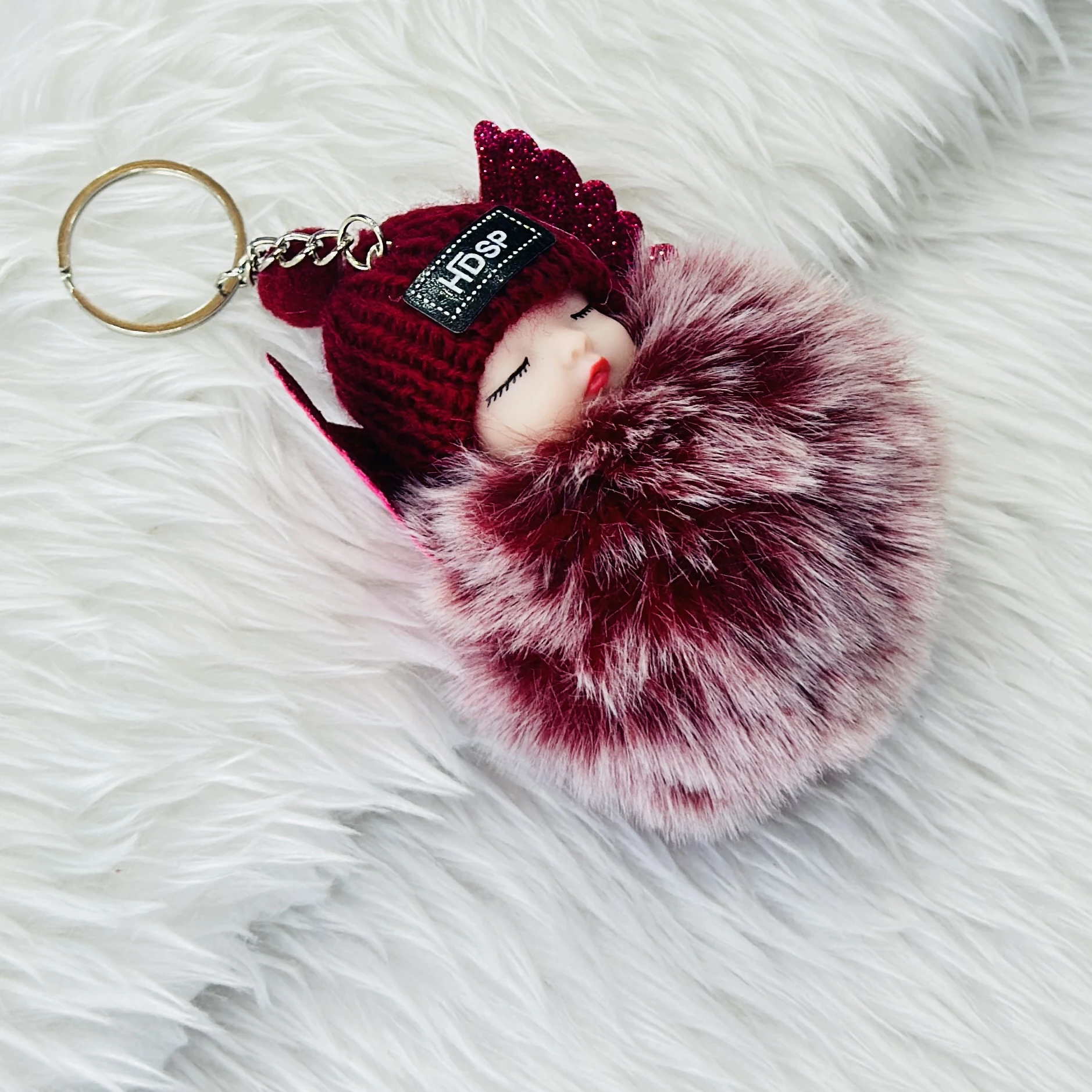sleeping baby doll keychain