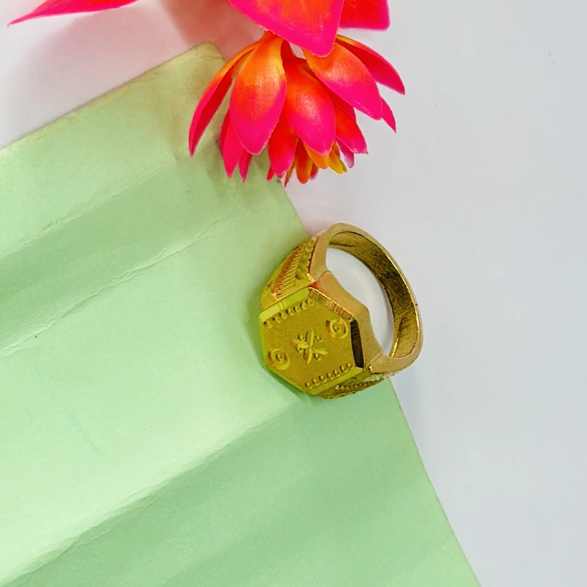 22kt yellow gold men's ring with a matte finish and machine-cut designs.