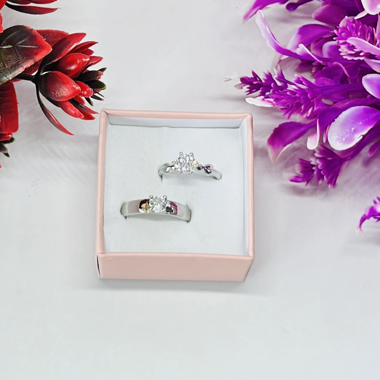 set of silver-plated, stone-studded, adjustable couple rings.