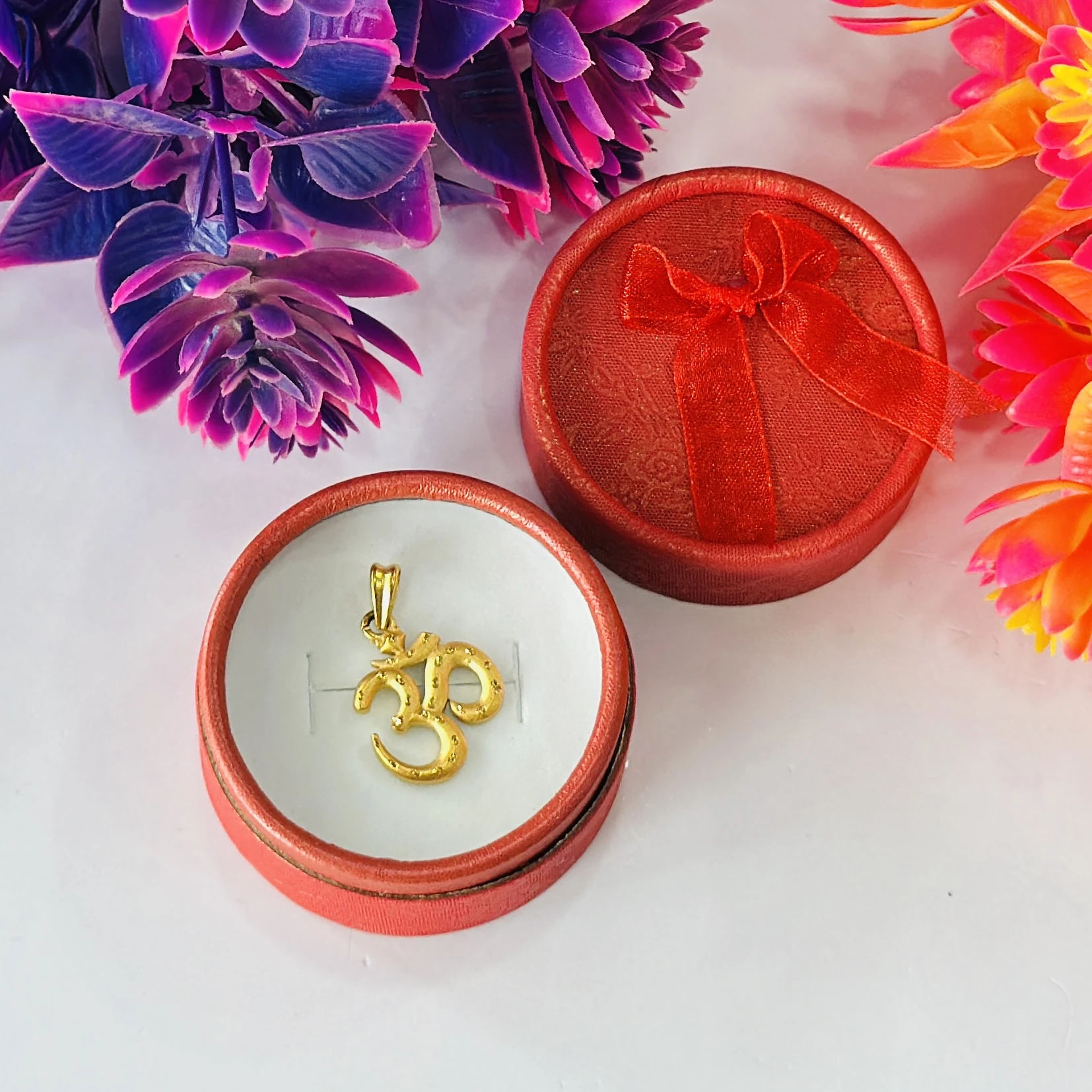 Gold plated Om pendant.