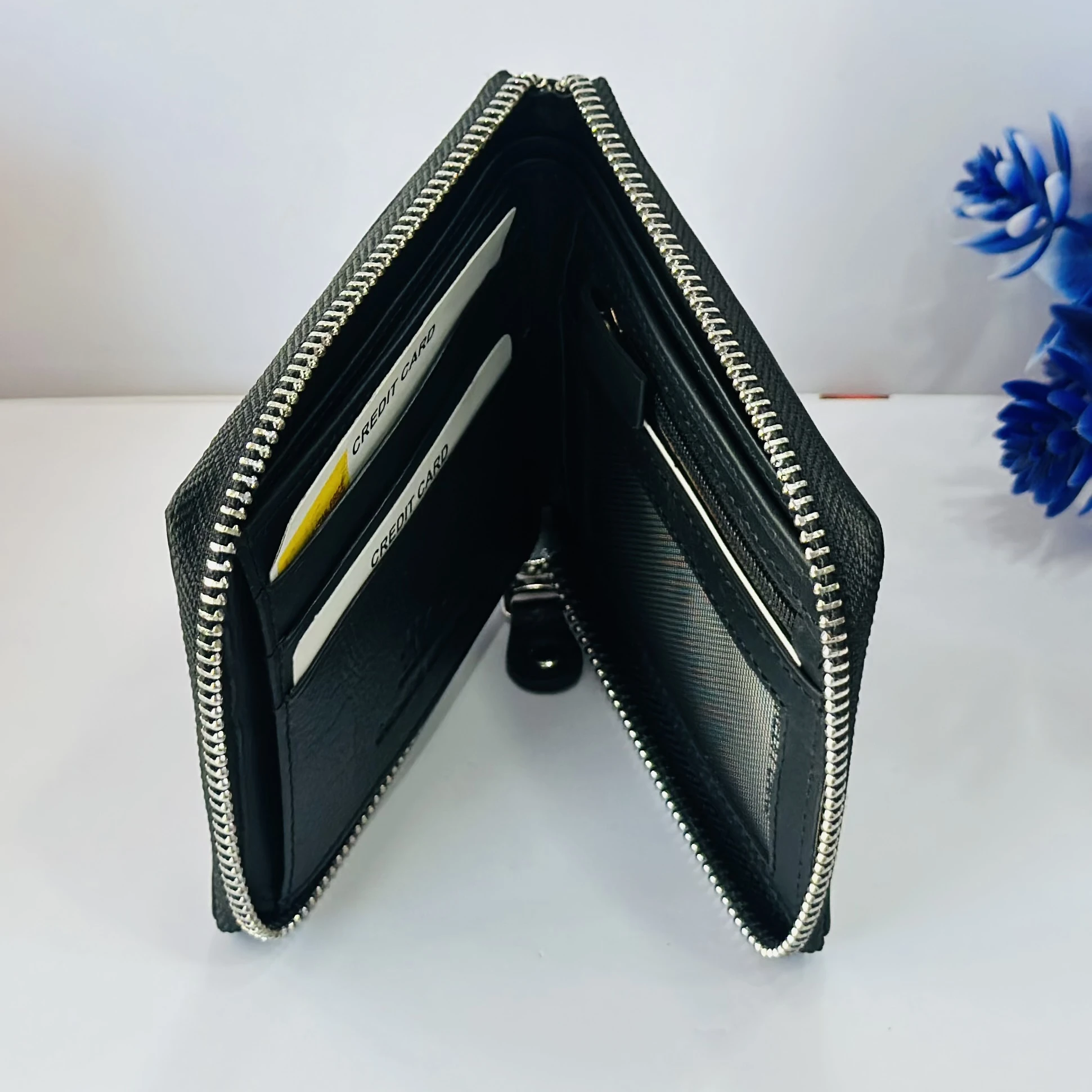 Black HZ leather zip-around wallet for men.