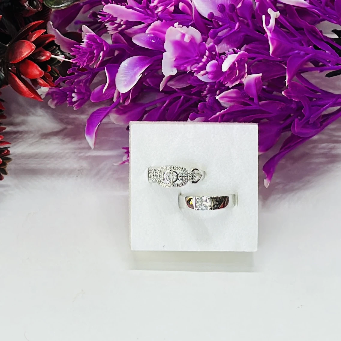 Set of silver-toned couple rings