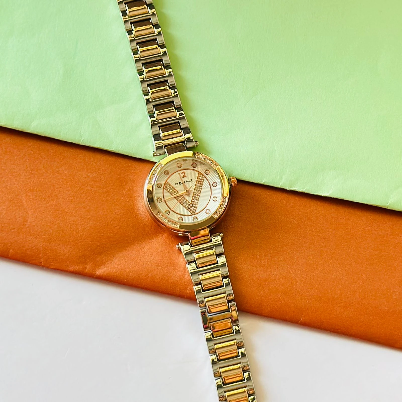 Florence brand two-tone metal analog watch for women.