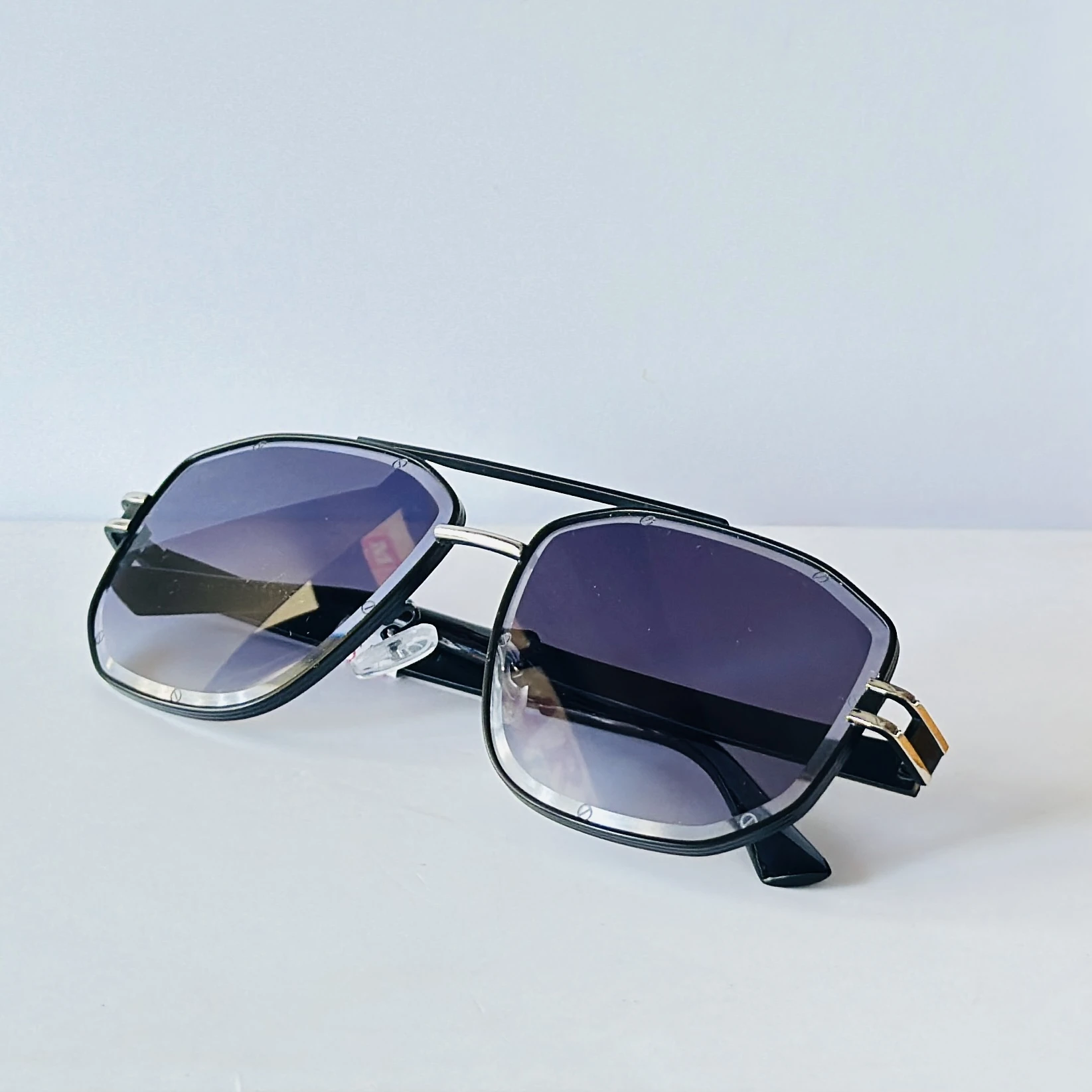 pair of Raw 7 branded men's rectangular sunglasses