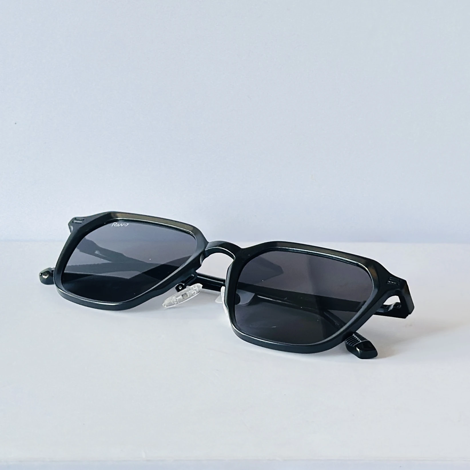 Rav-7 sunglasses feature a retro square black metal frame
