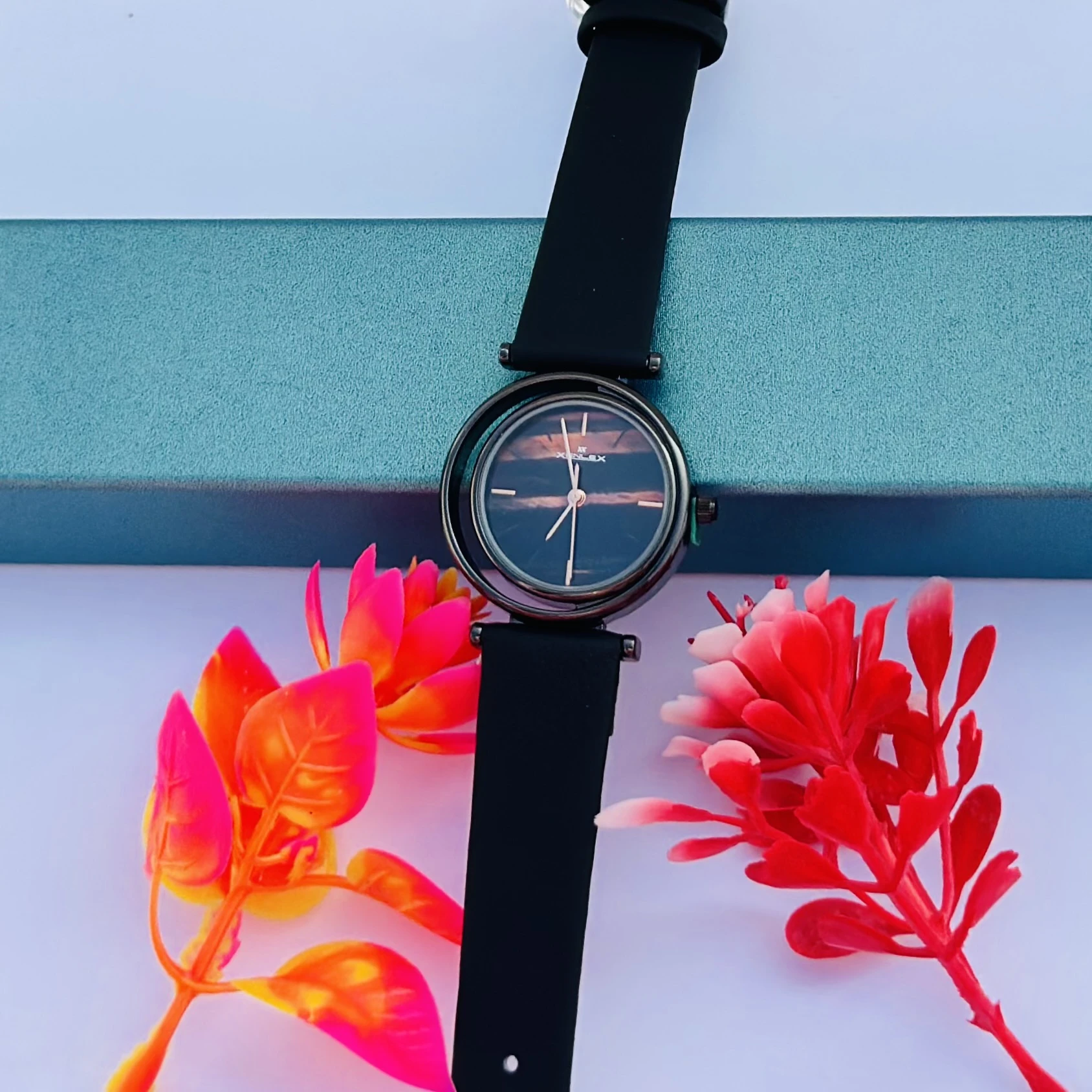 Analog Wrist Watch for Women, in the black variant with a brown/black dial.
