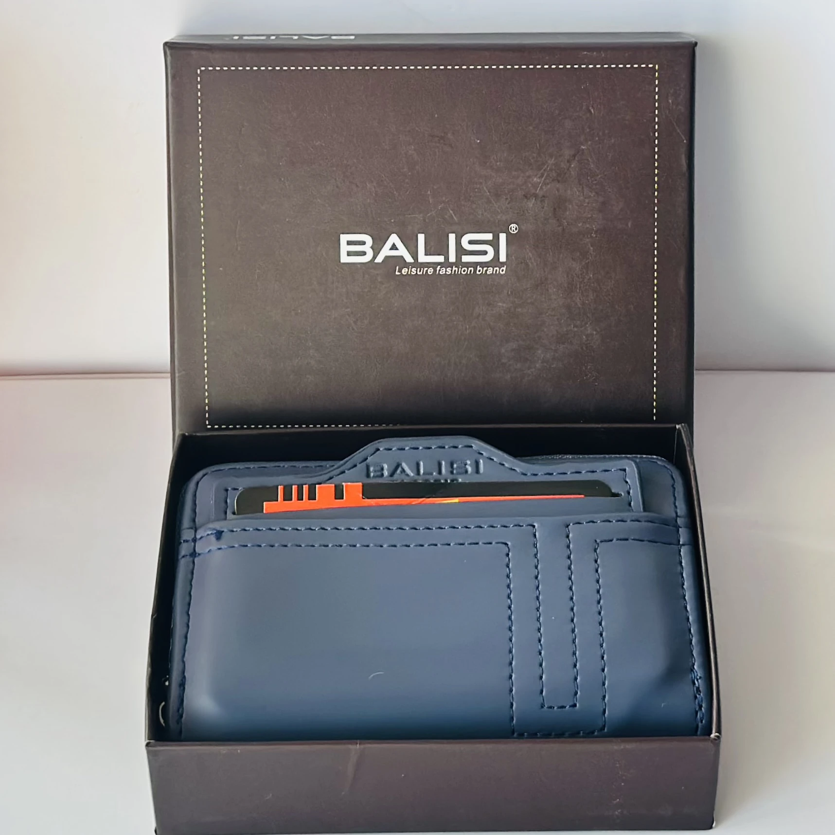 Balisi plain zip button men's wallet in a blue color, likely made of PU leather.
