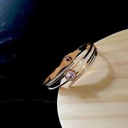 elegant gold-plated crystal-studded cuff bracelet