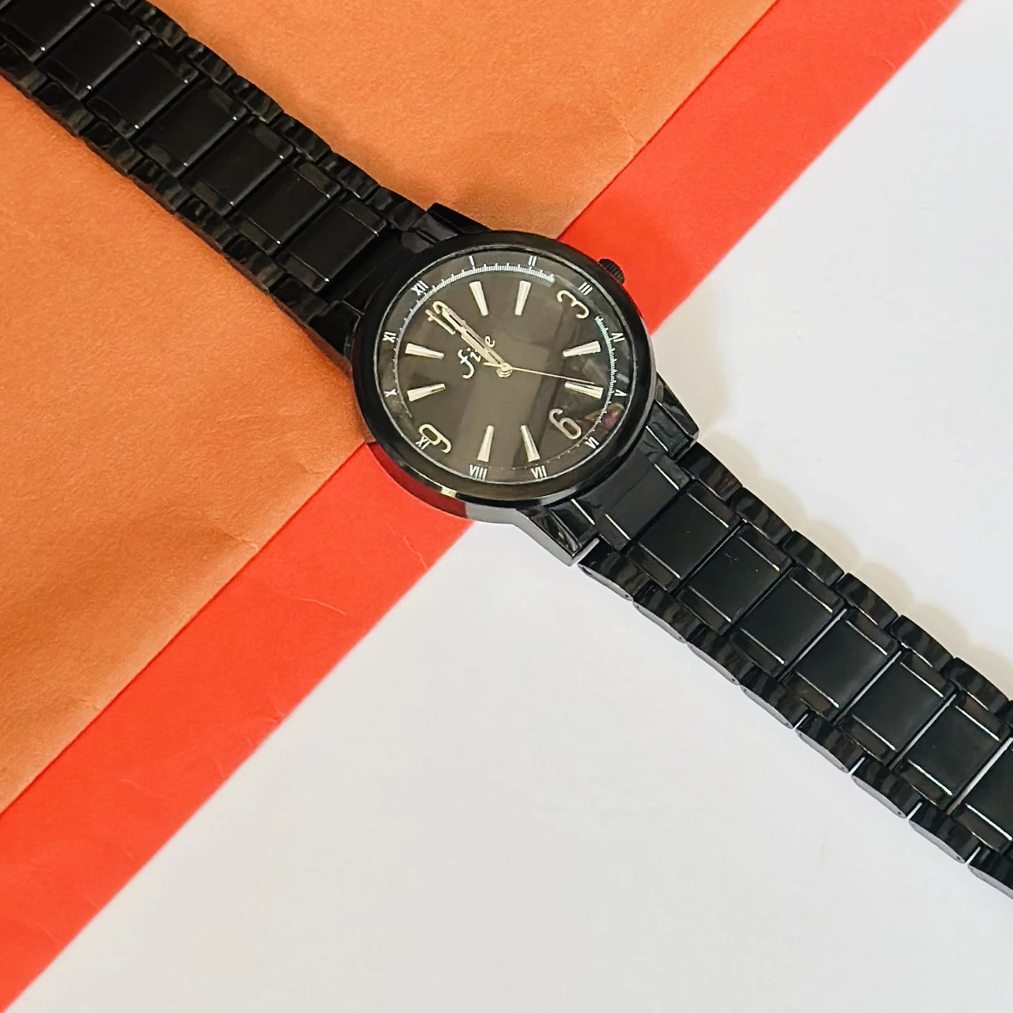 Black analog wristwatch