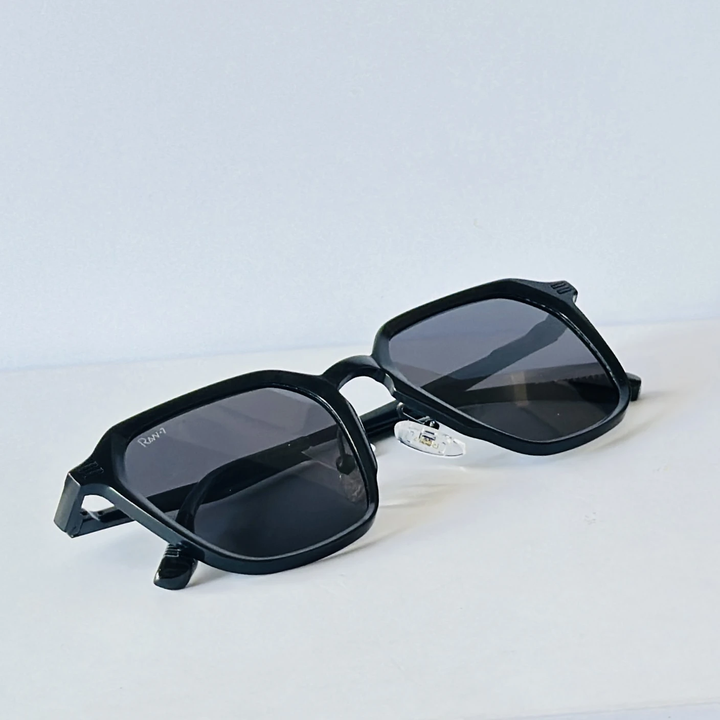 Rav-7 sunglasses feature a retro square black metal frame