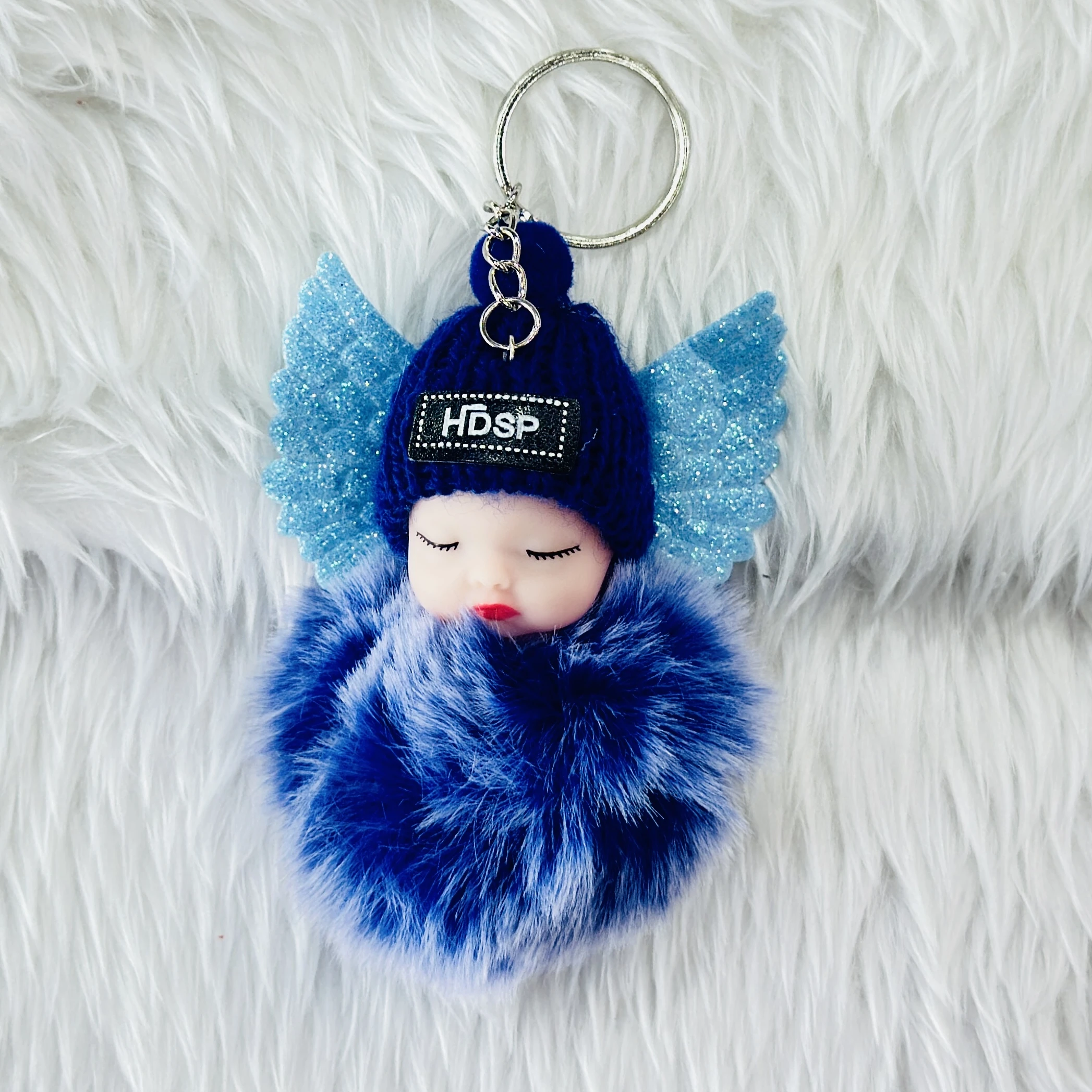 sleeping baby doll keychain