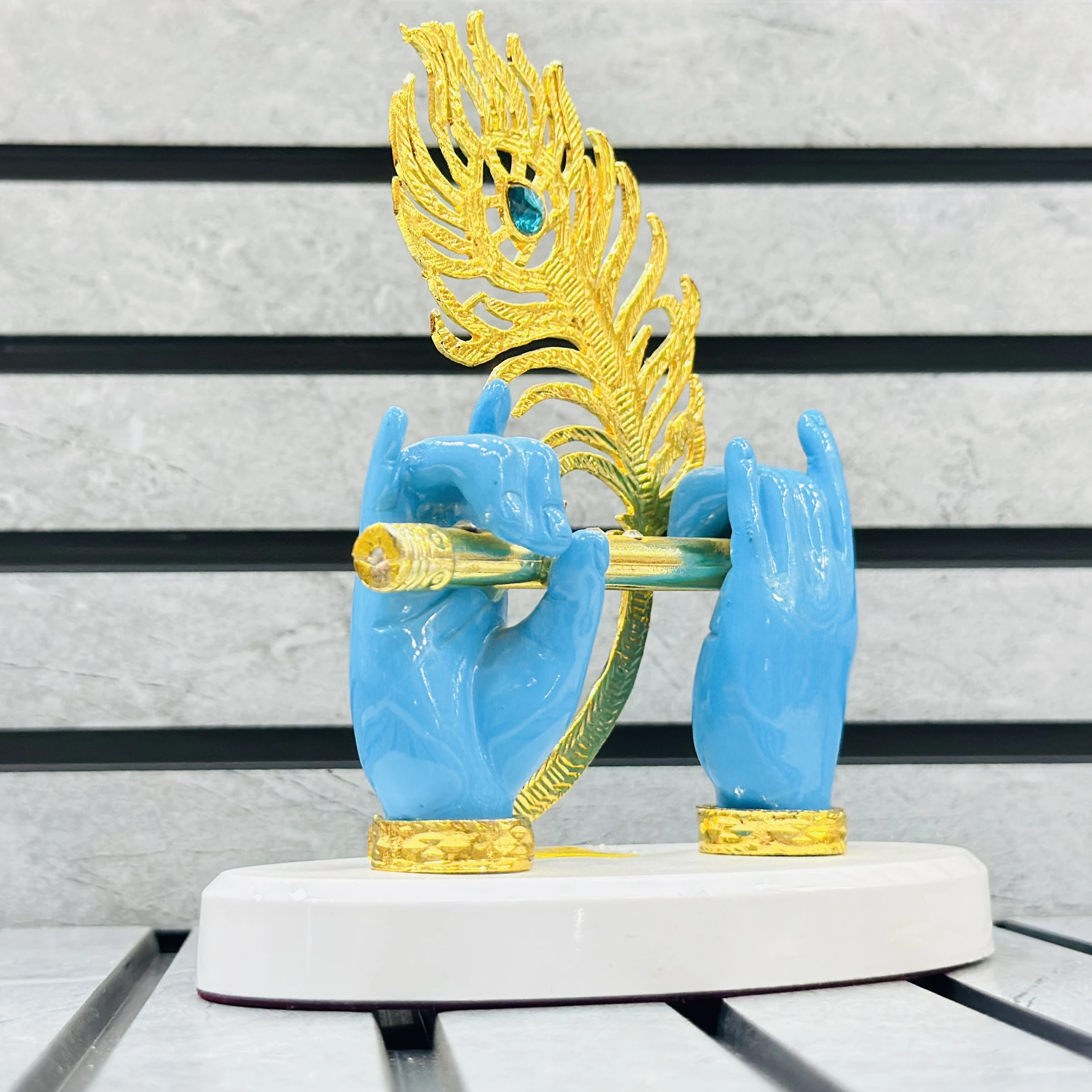 Gold plated Lord Krishna hands with flute and peacock feather figurine.