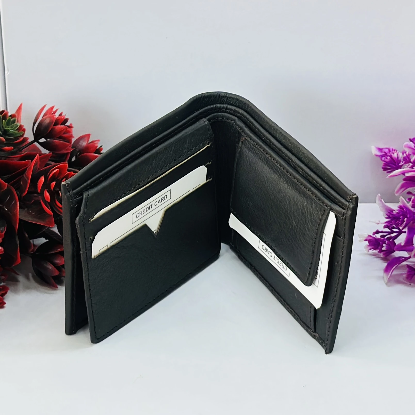 Coach men's black leather slim bifold wallet.
