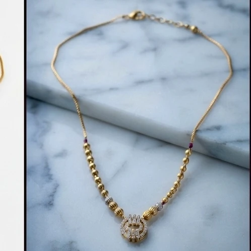 alloy necklace features a circular cubic zirconia pendant