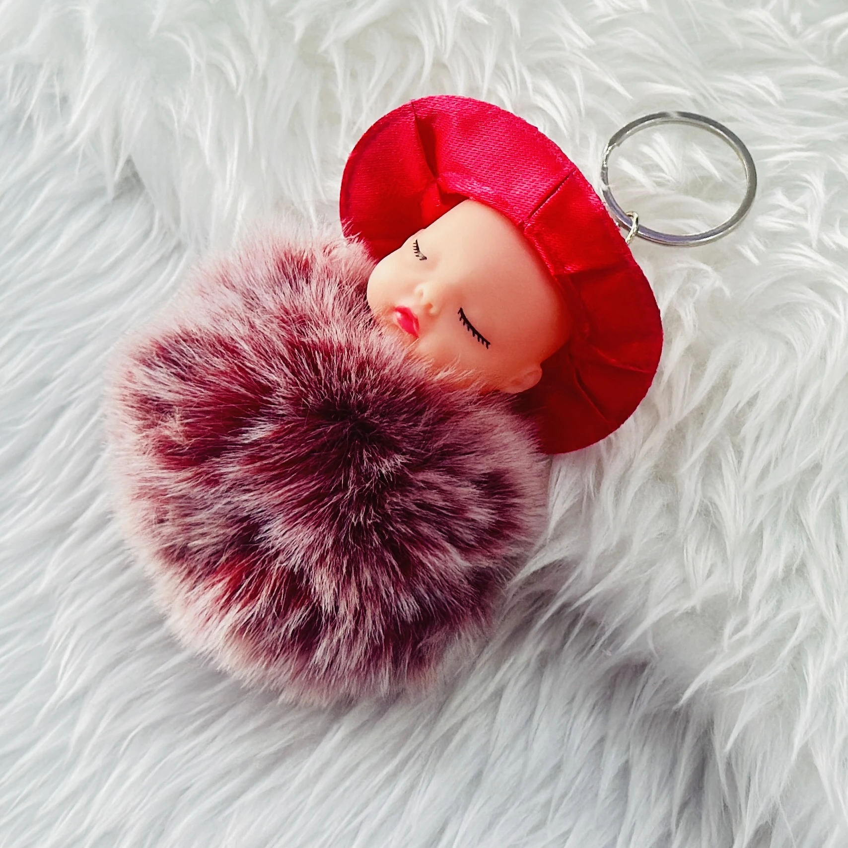 sleeping baby doll fluffy pom pom keychain