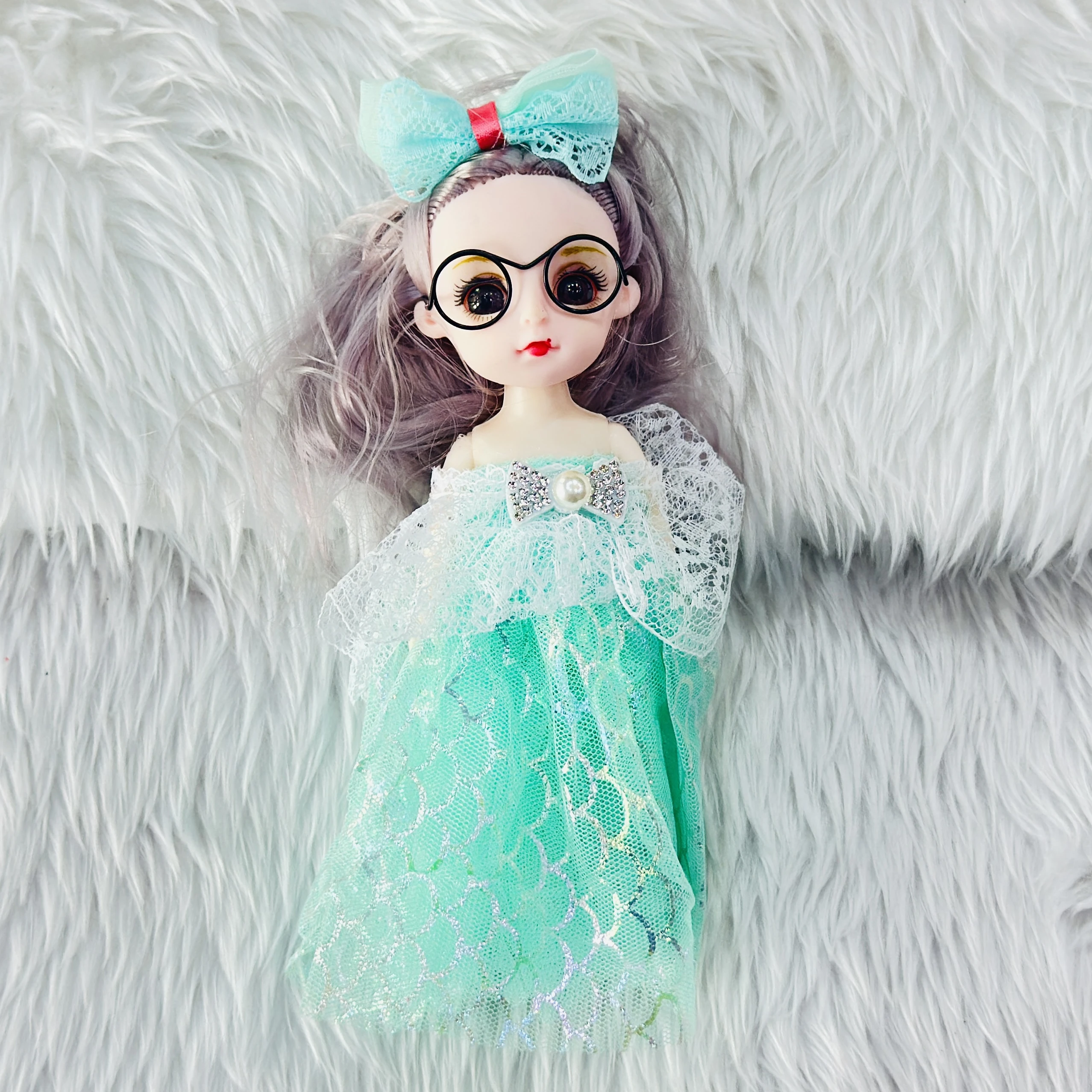 Doll  keychain featuring a fashionable