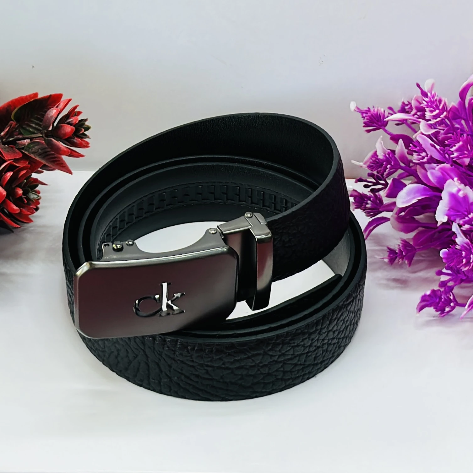Calvin Klein black genuine leather men's belt with an automatic buckle.