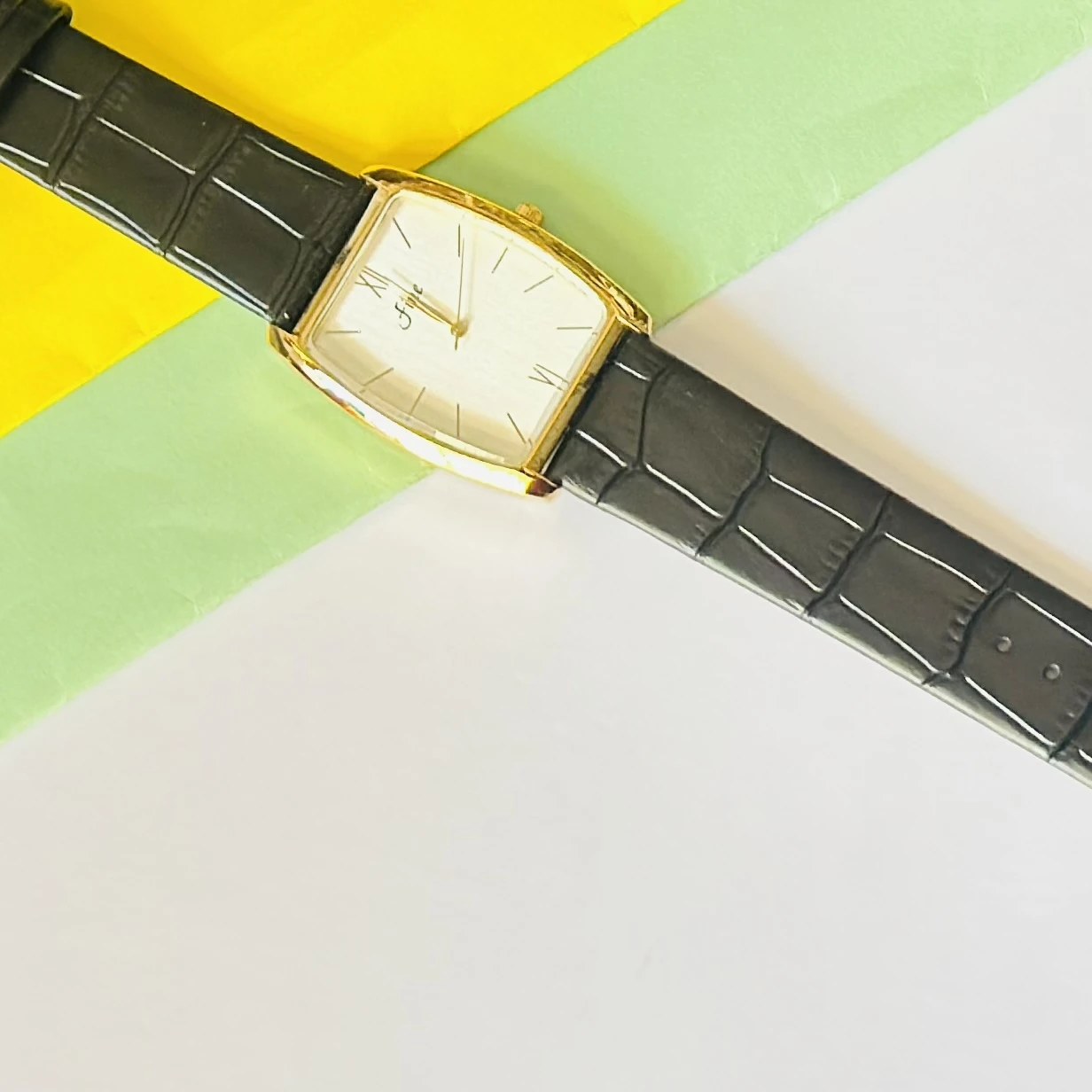 Edge quartz analog white dial black leather strap watch.
