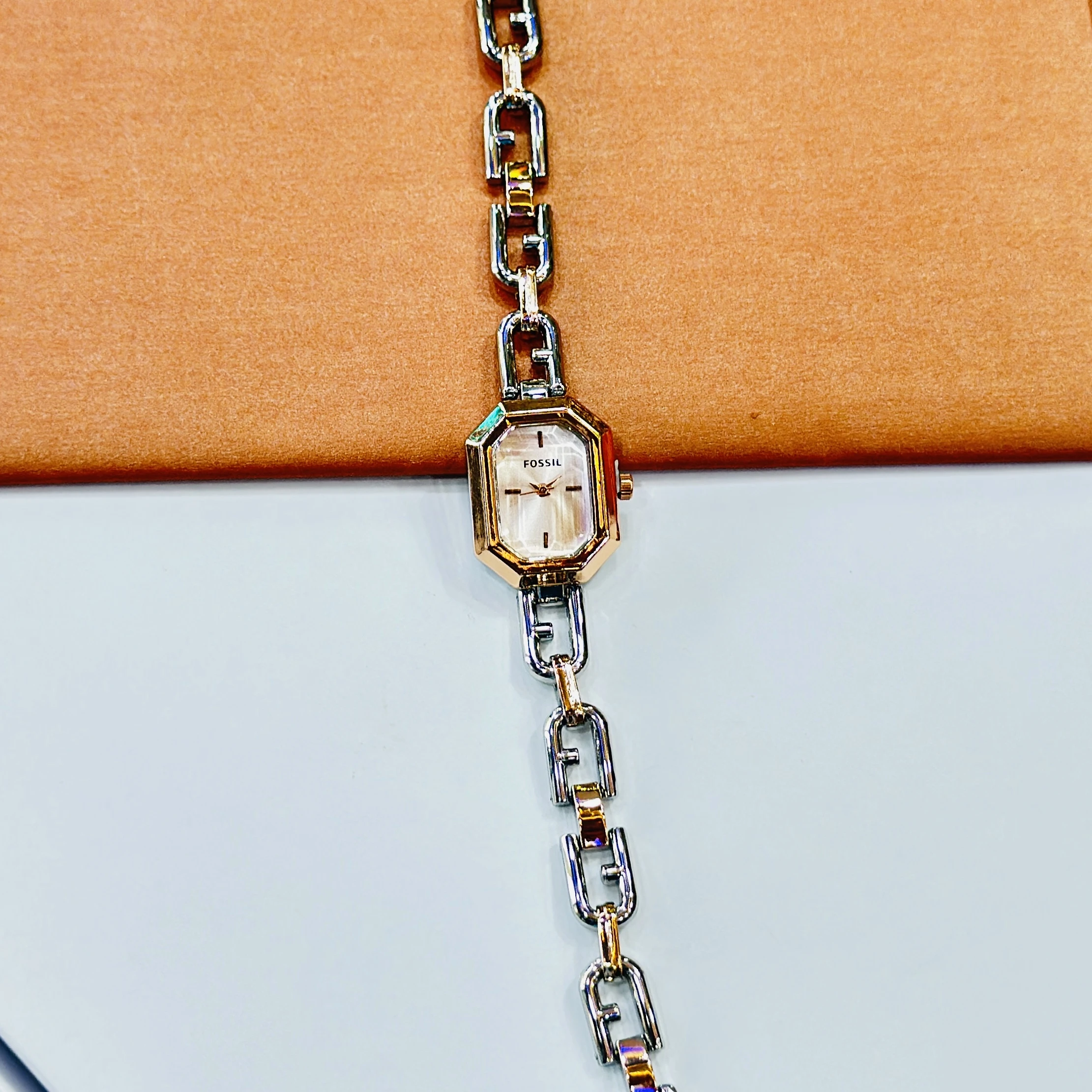 Fossil Harlow Mini two-hand rose gold-tone watches with chain bracelets.