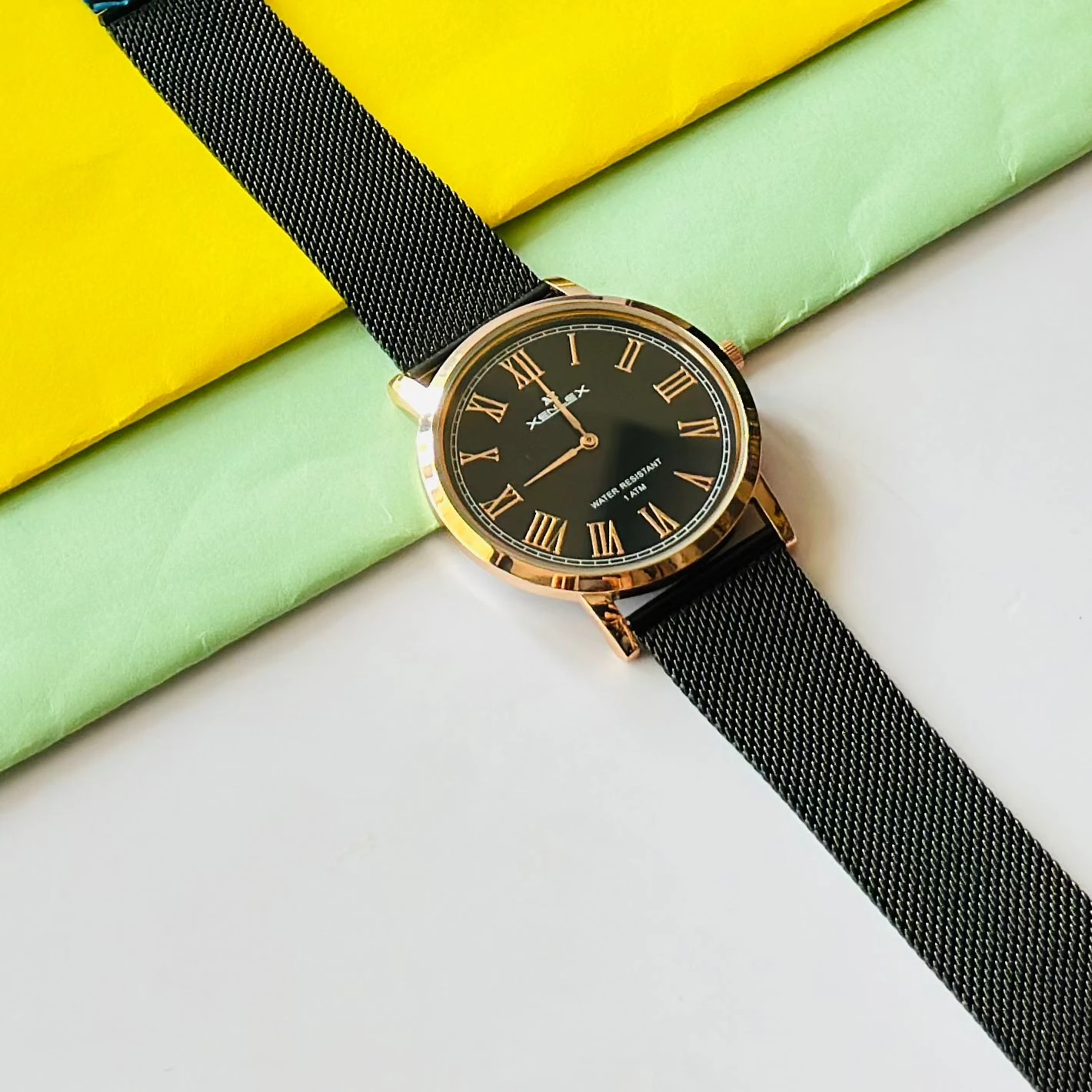 Black Snille Date Series analog watch with a white dial and black leather strap.