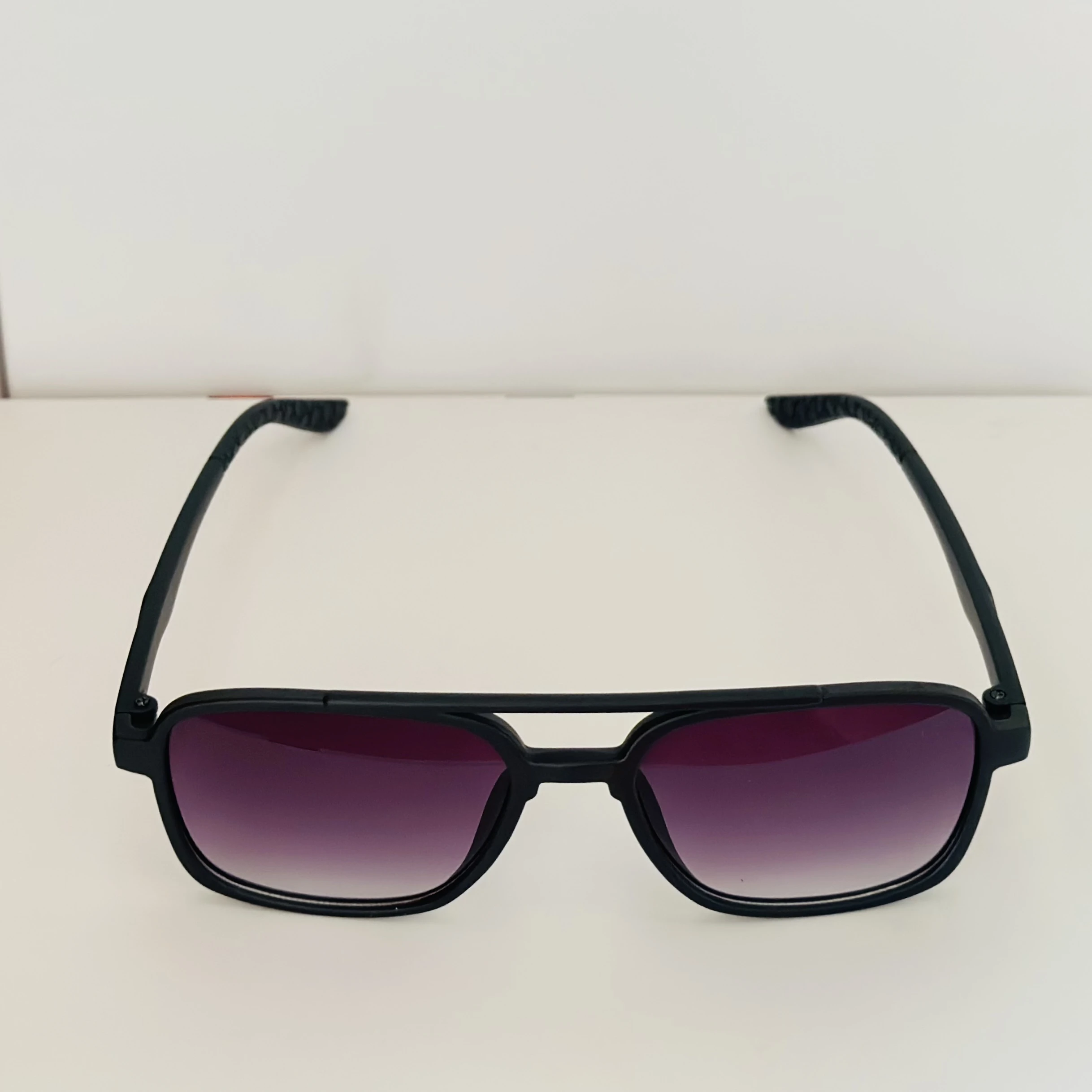 Black retro square sunglasses with gradient purple lenses.