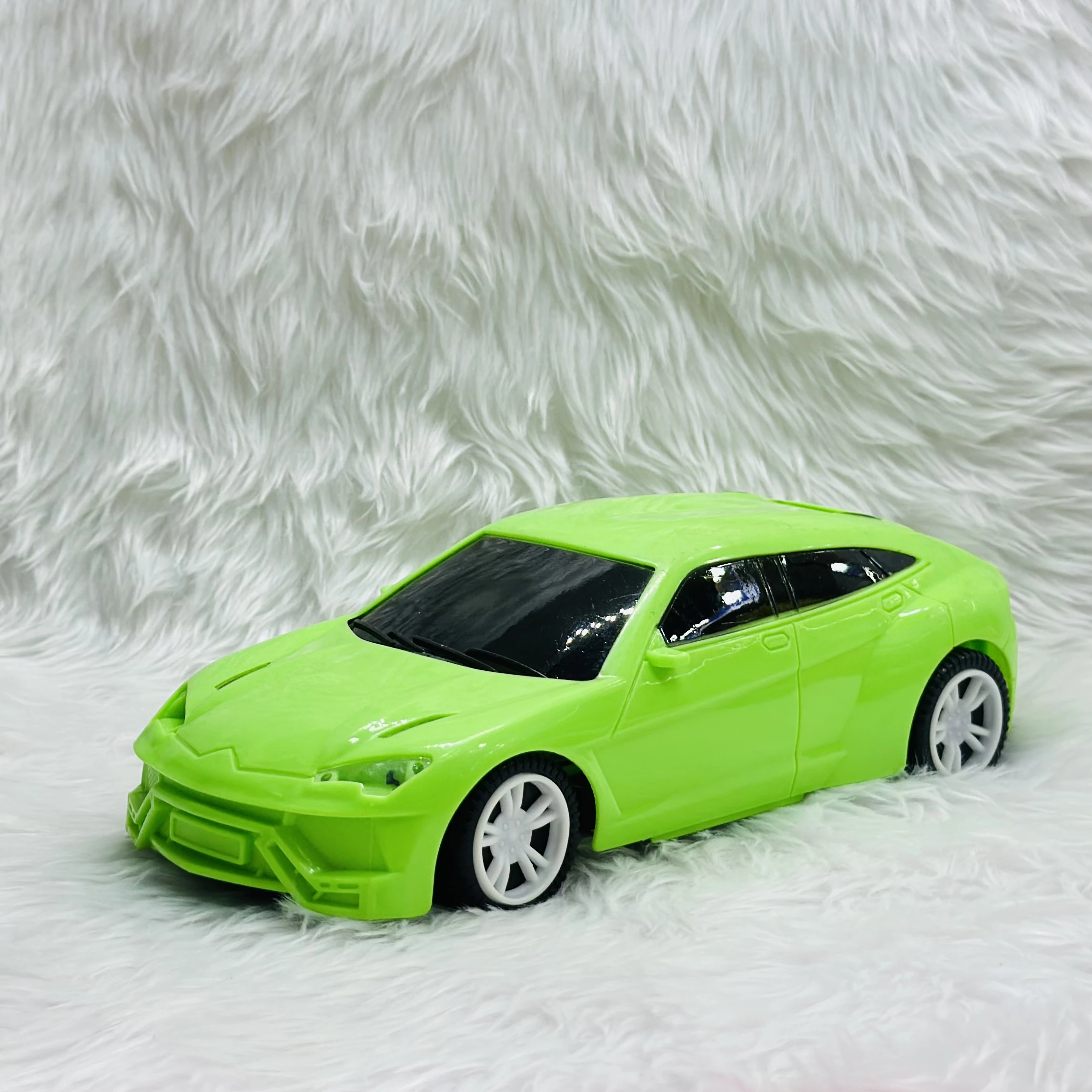 Green toy car, which is a model of a Lamborghini Urus SUV.
