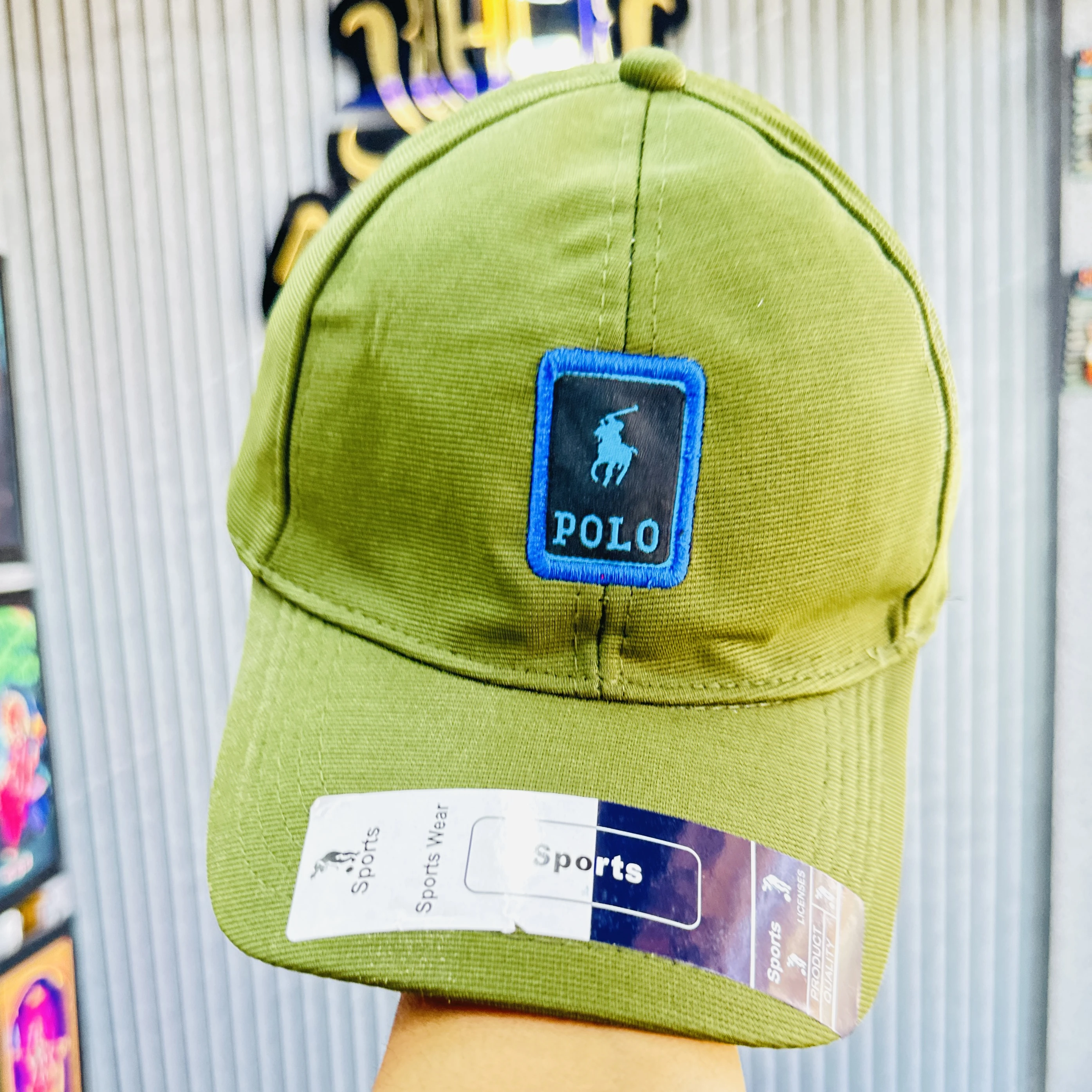 appears to be a green cotton blend baseball cap