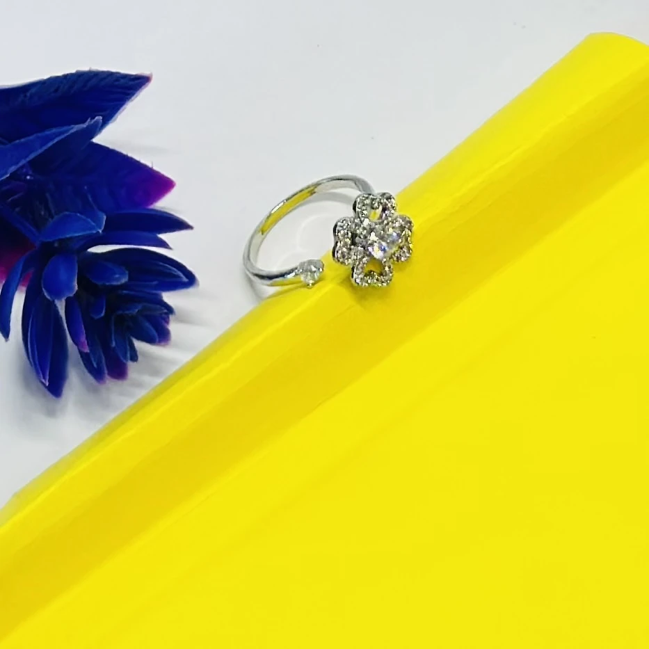 An adjustable silver-toned flower ring