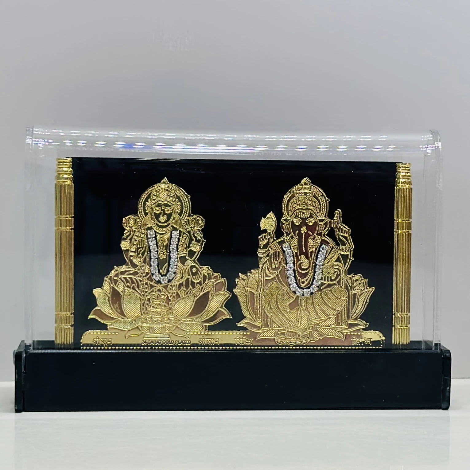 gold-plated idol of the Hindu deities Lakshmi and Ganesha