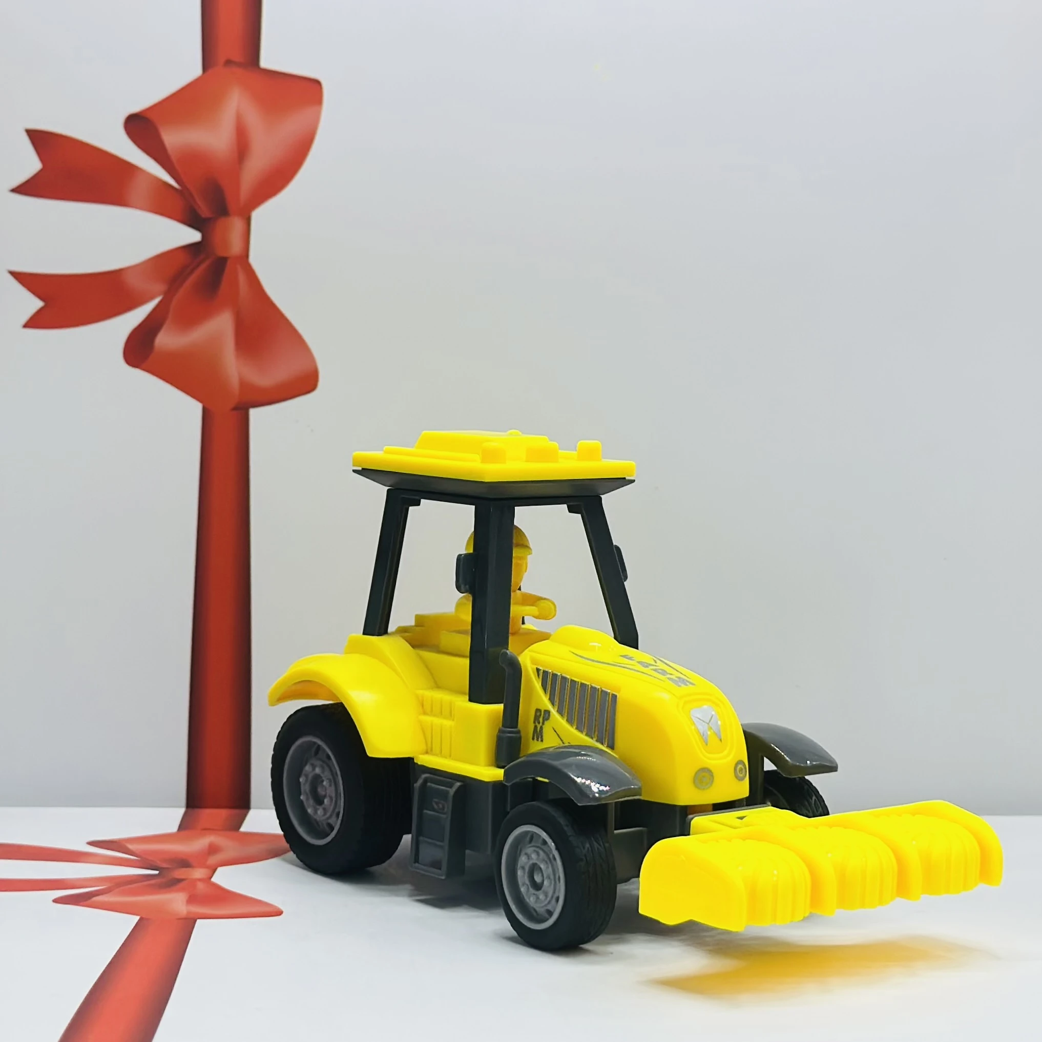 Yellow plastic toy tractor