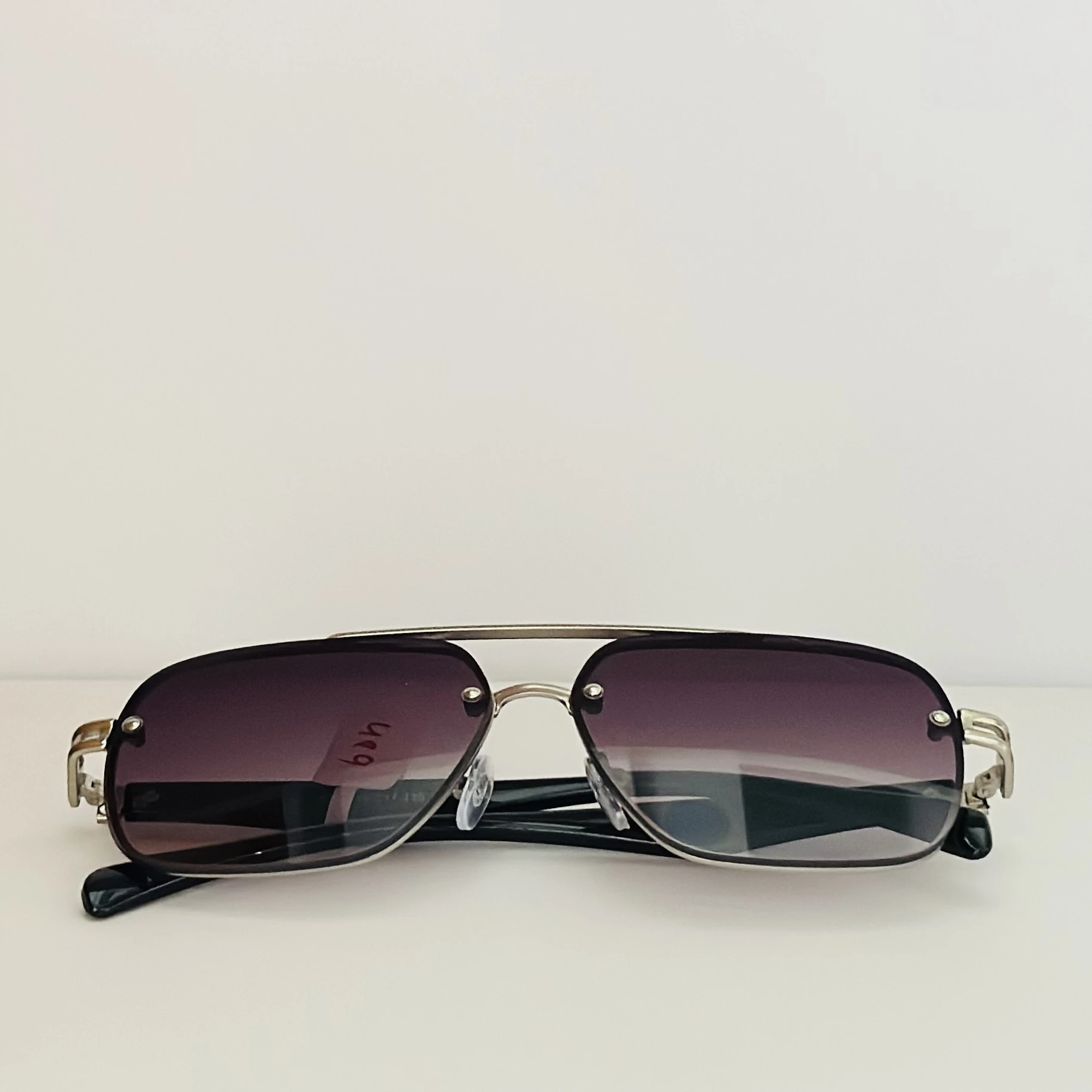 gradient square sunglasses with a black frame.